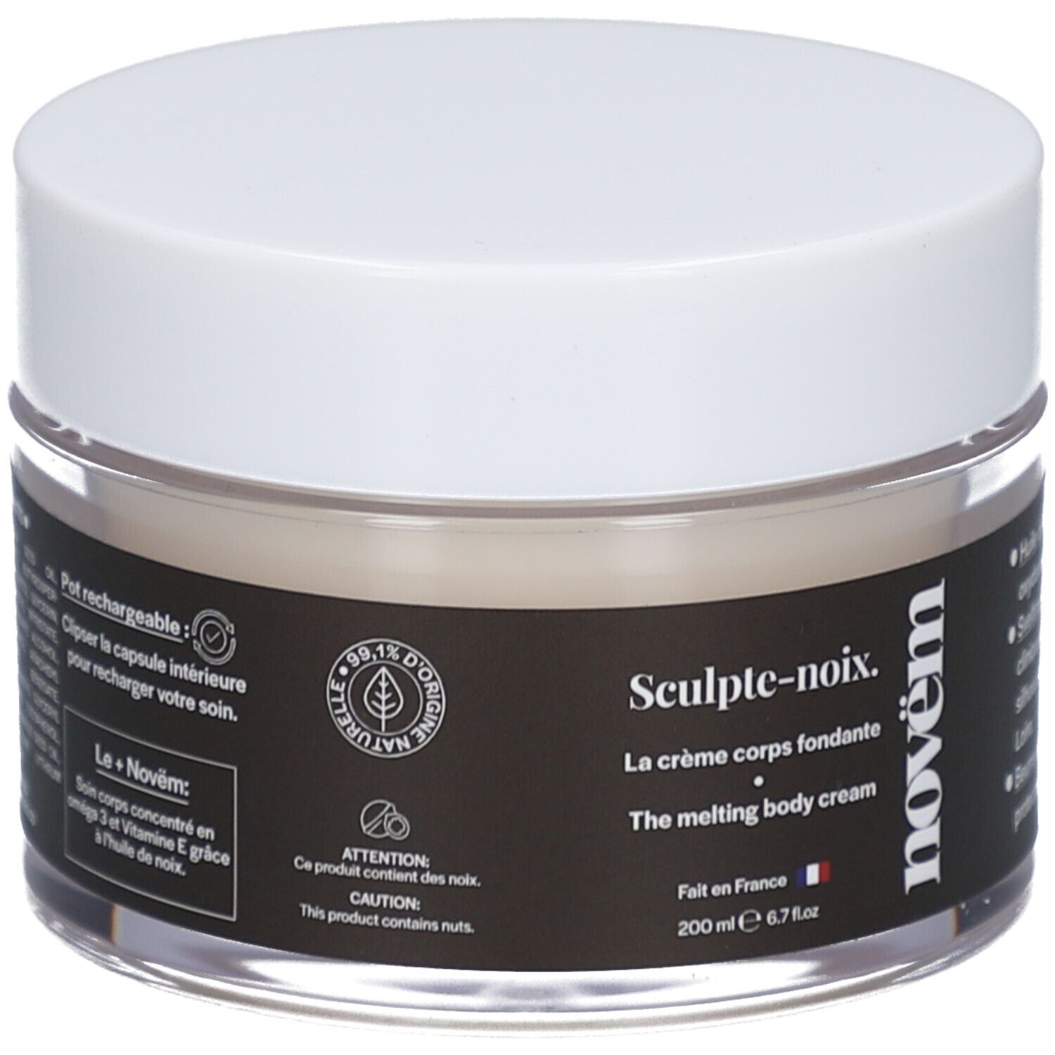 Pot de crème avec couvercle blanc. Étiquette noire avec texte: Sculpt-noix, La crème corps fondante, novëm. 200 ml. Verre transparent.