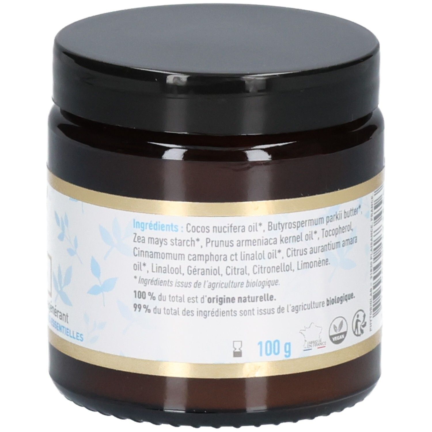 Gros plan de la liste des ingrédients sur l'étiquette du pot en verre brun. Contient Belle oemine Bio Eclat Intense Baume Universel Régénérant.