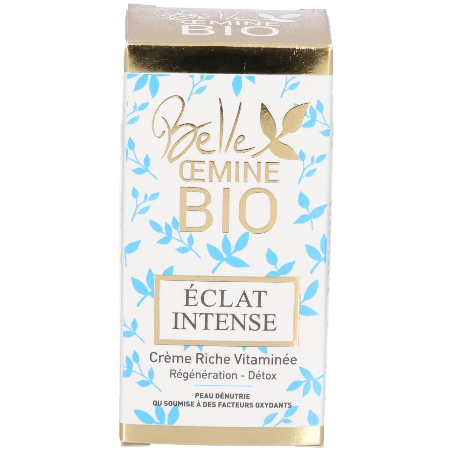 Emballage avec inscription dorée, motif de feuilles bleues et sceau BIO.