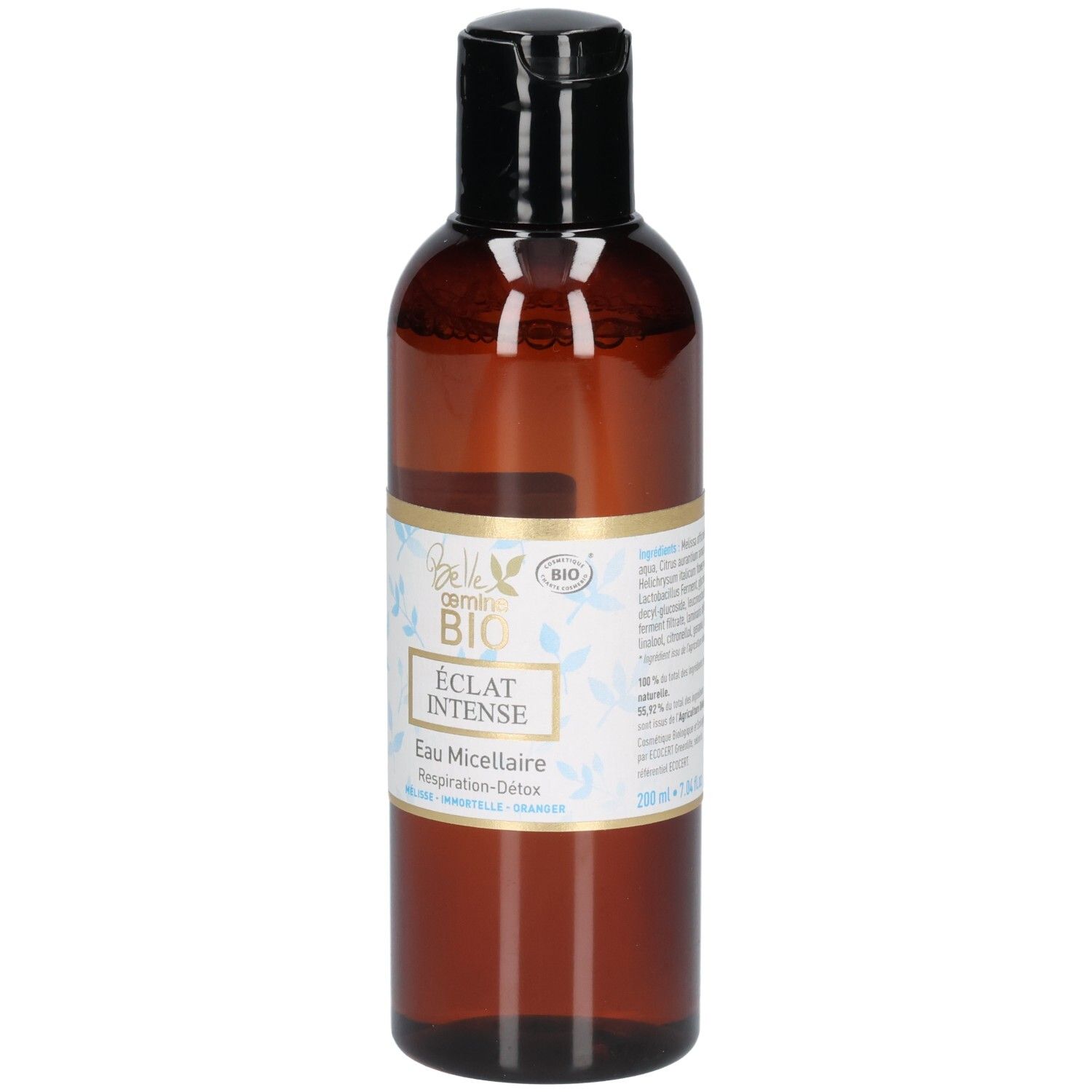 Flacon brun avec bouchon noir, étiquette avec sceau BIO et motif floral.