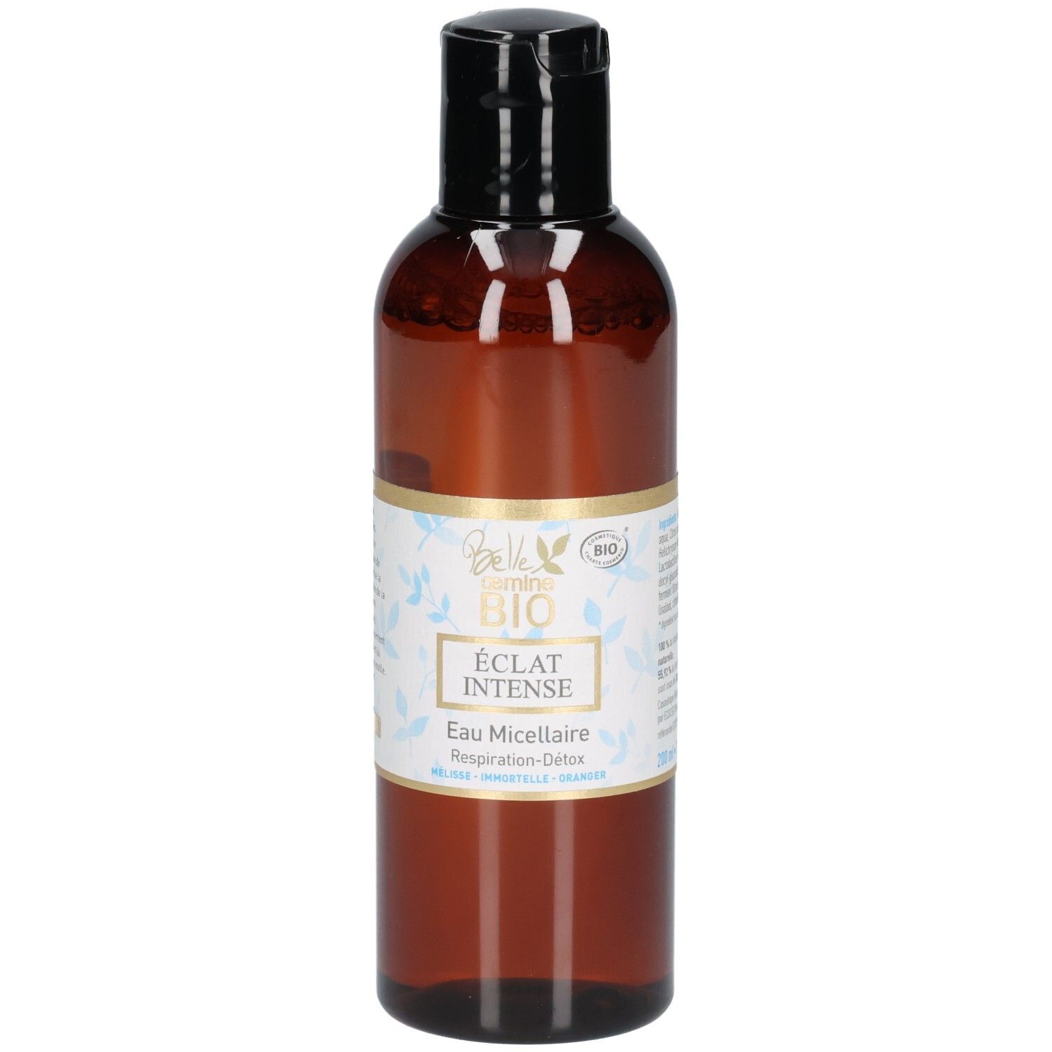 Flacon brun avec bouchon noir, étiquette avec sceau BIO et motif floral.