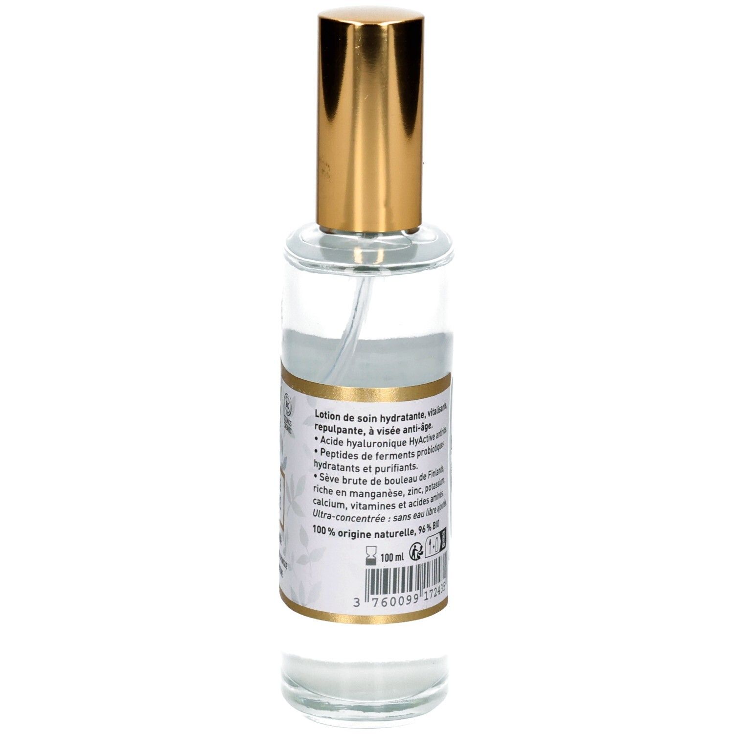 Arrière d'un flacon en verre avec pompe pulvérisatrice. Étiquette indiquant le volume '100 ml'.