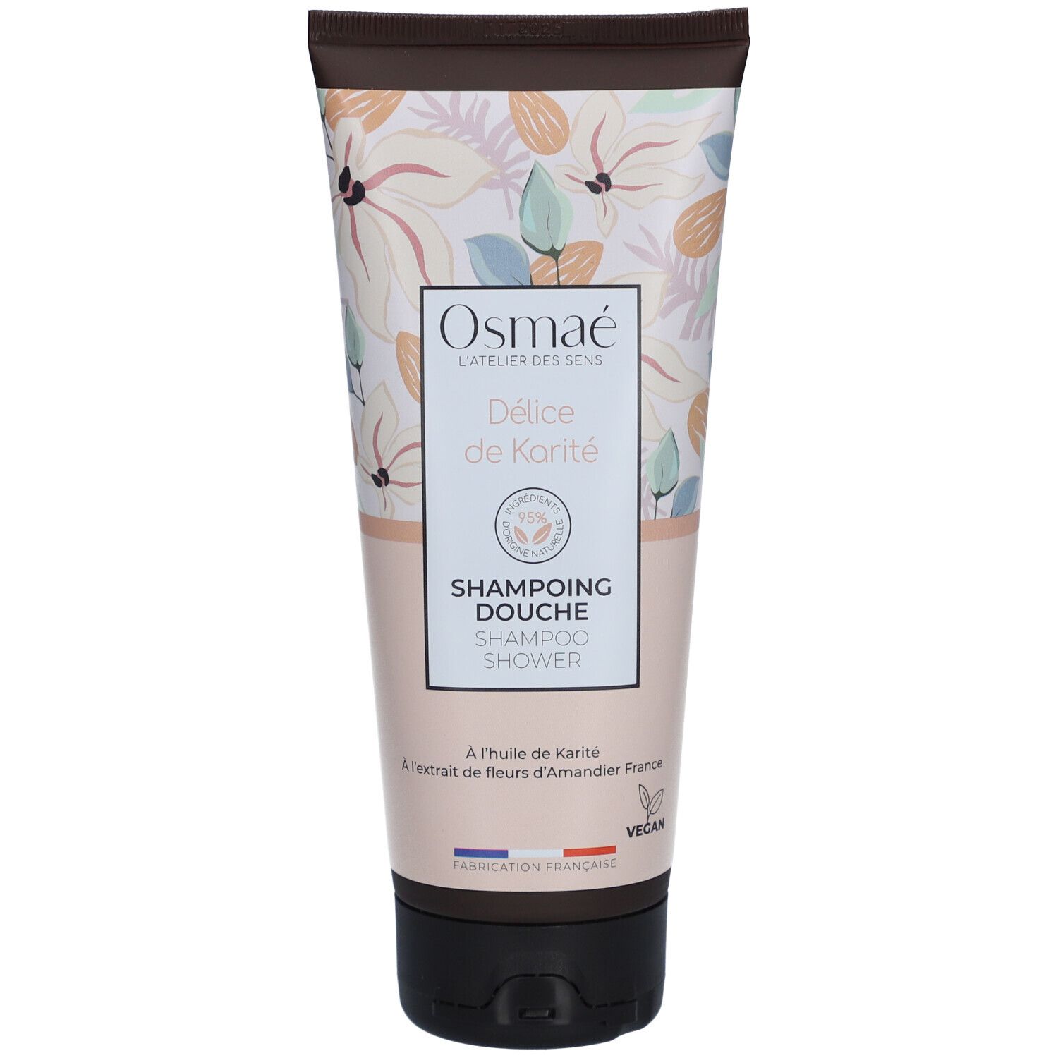 Tube de Shampoing Douche Délice de Karité OSMAE. Motif floral. Inscription: Shampoing Douche, à l'huile de Karité, Vegan.