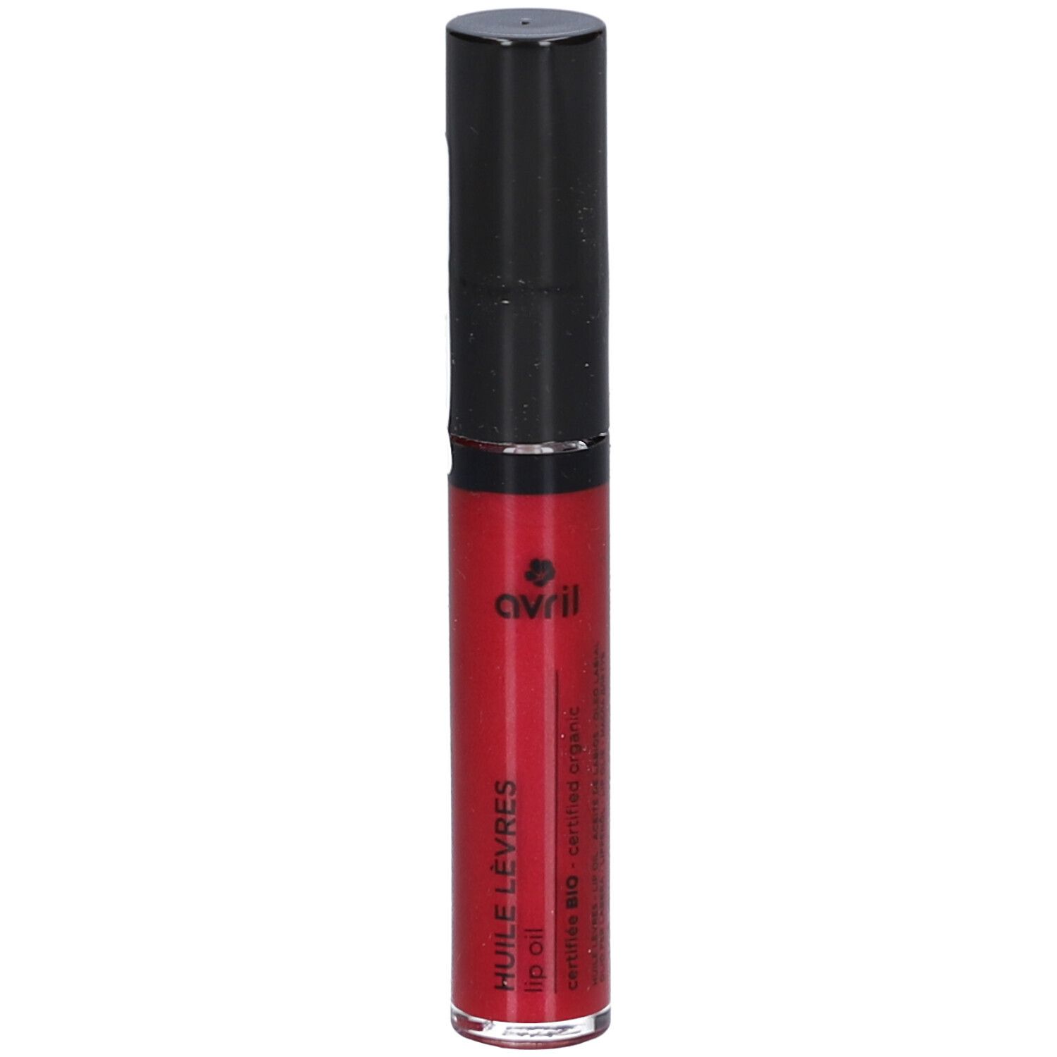 Huile à lèvres rouge dans un tube transparent avec un bouchon noir. Le produit porte le logo Avril et l'inscription "HUILE LEVRES lip oil".