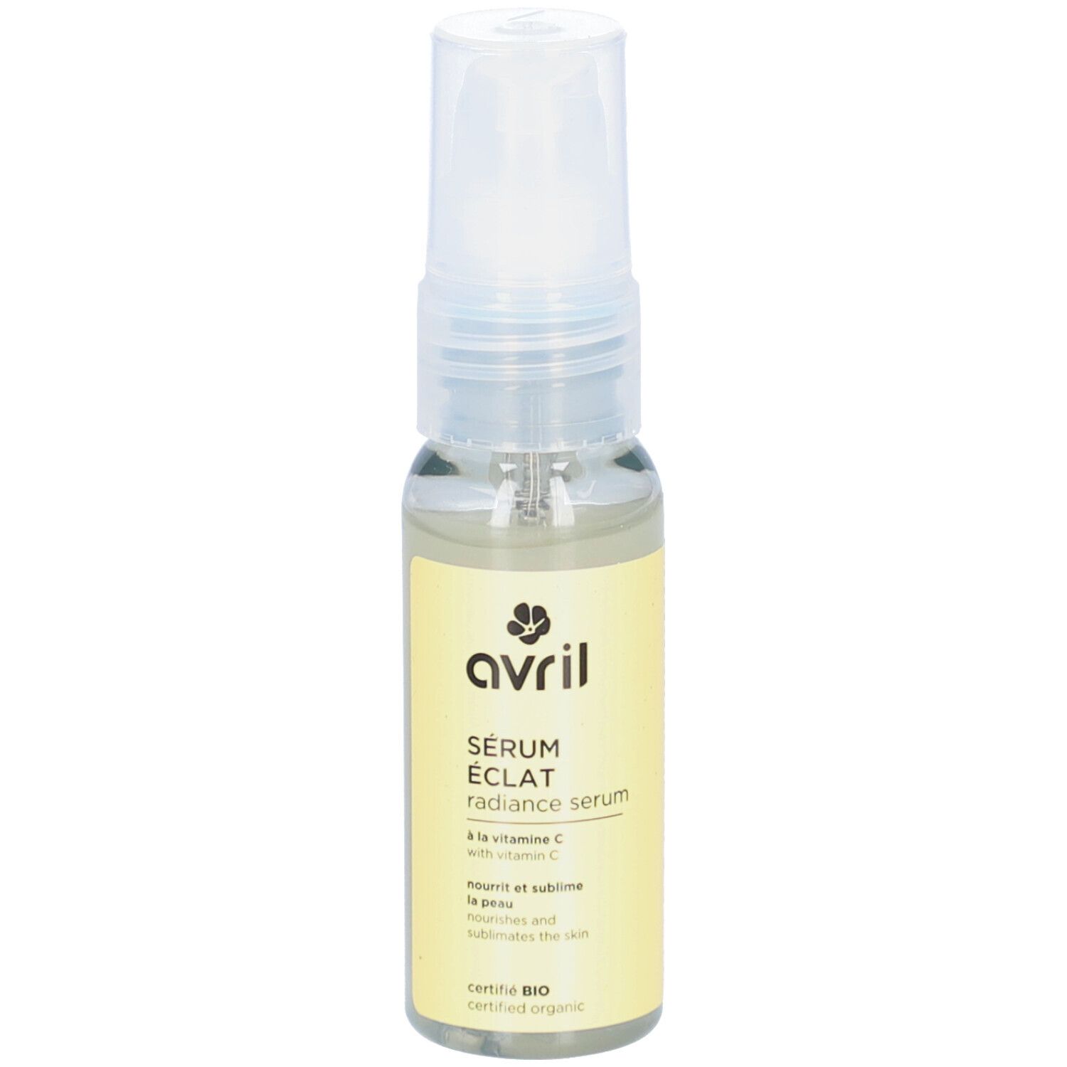Sérum Eclat AVRIL, liquide transparent en flacon de verre avec vaporisateur. Étiquette jaune avec texte et logo.