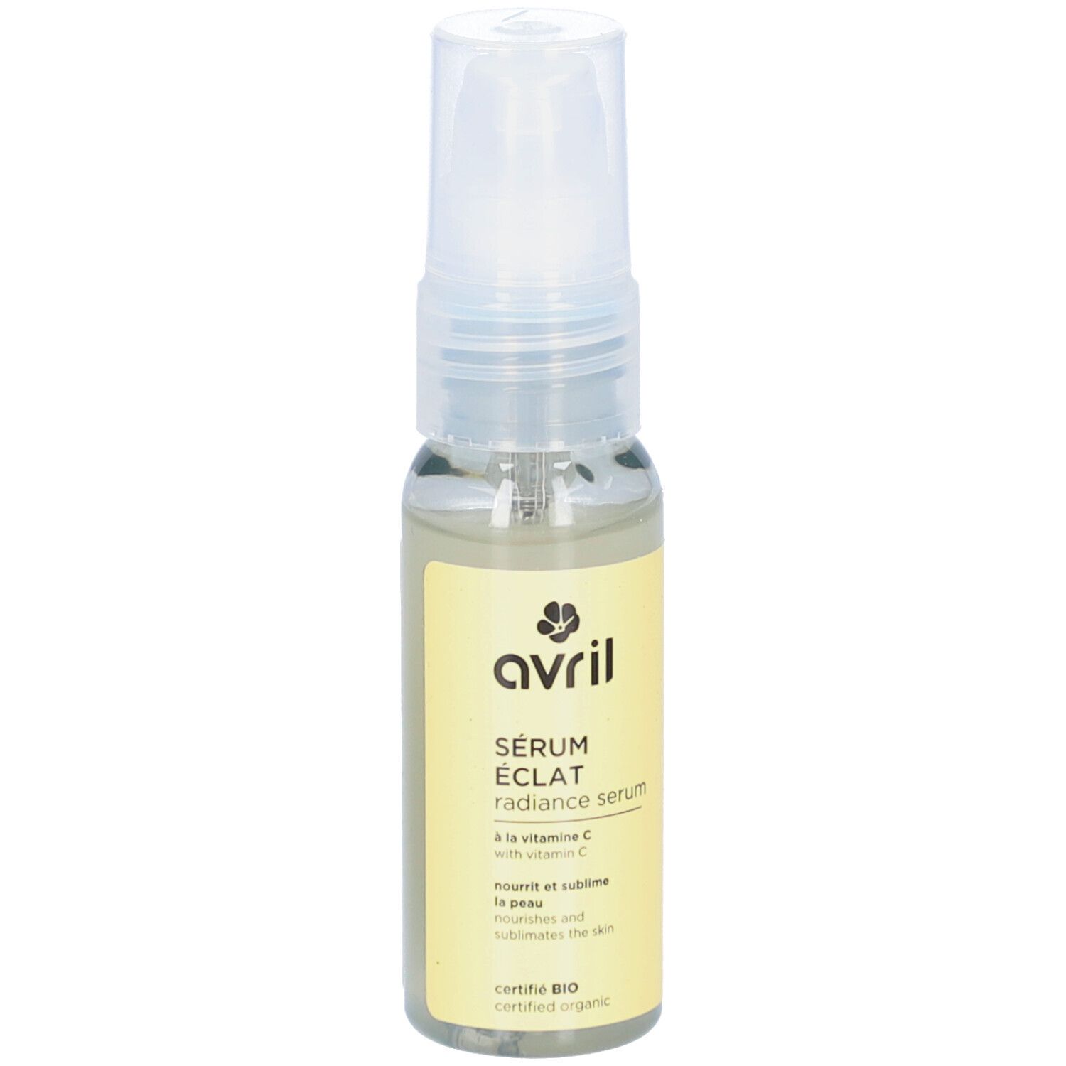 Sérum Eclat AVRIL, liquide transparent en flacon de verre avec vaporisateur. Étiquette jaune avec texte et logo.