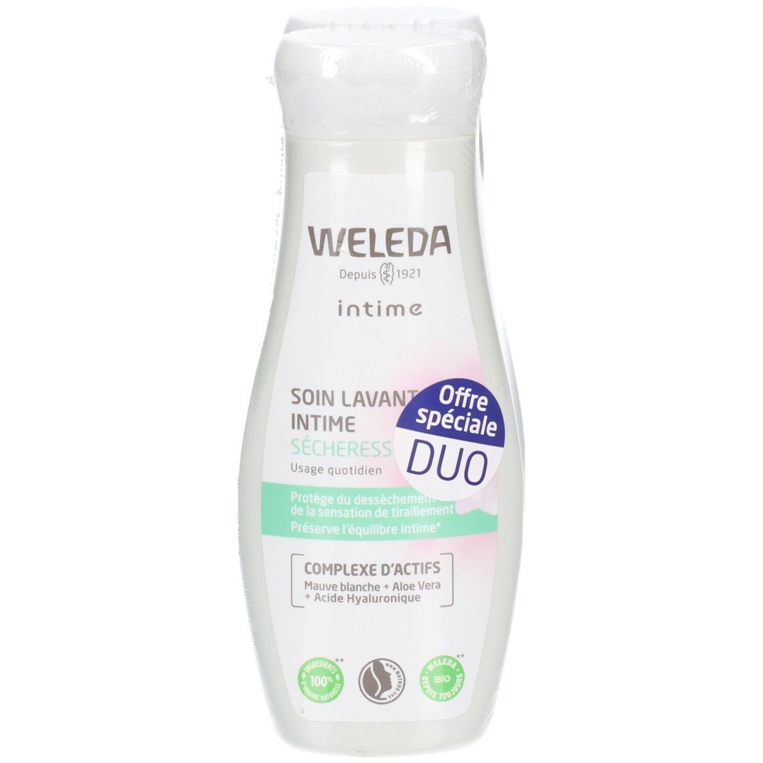 Flacon blanc Weleda Intime. Étiquette avec texte: SOIN LAVANT INTIME SECHERESS, DUO, COMPLEXE ACTIFS. Logo bio.