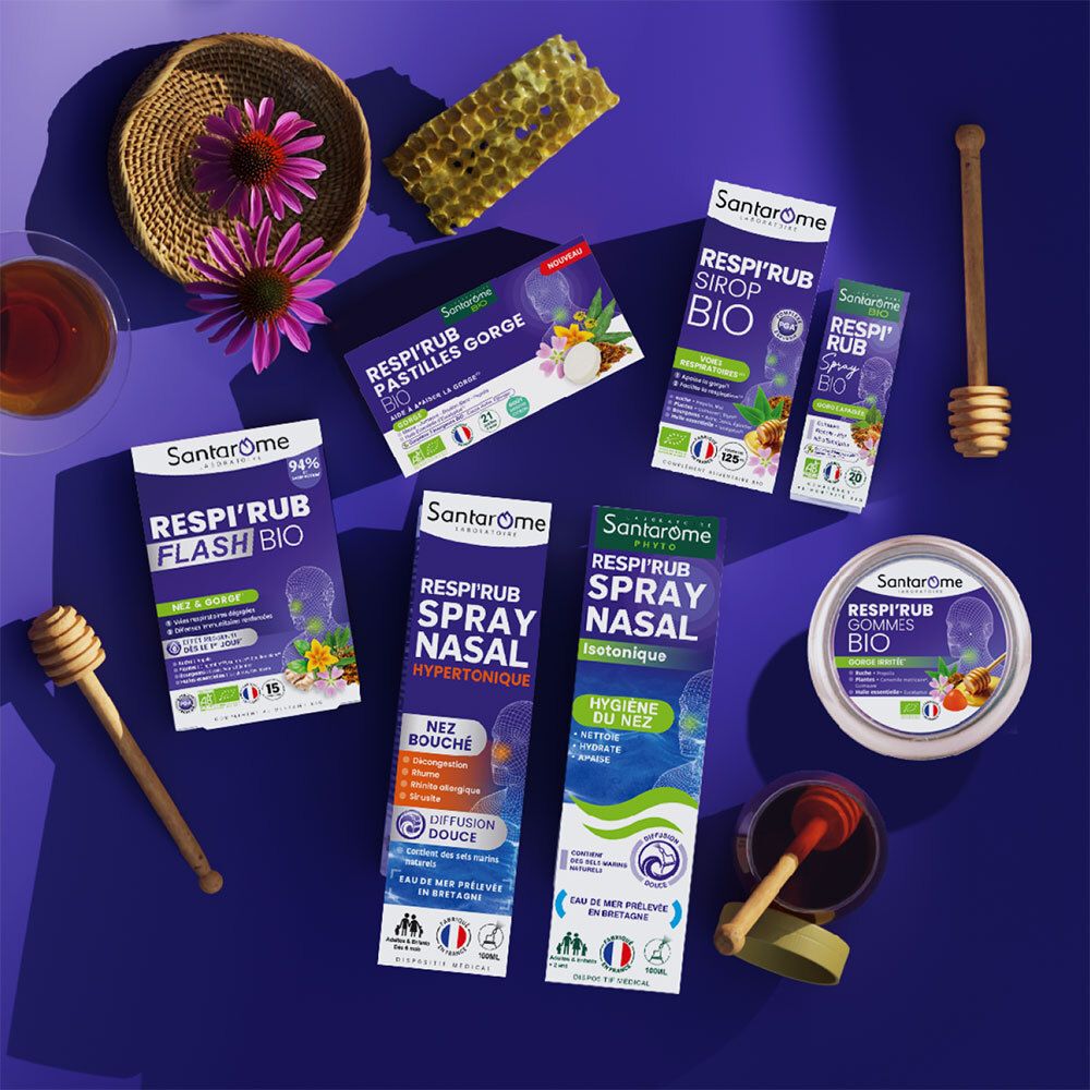 Divers produits Santarome. Pastilles, spray, gommes Respi'Rub. Miel, cuillères à miel, fond violet.