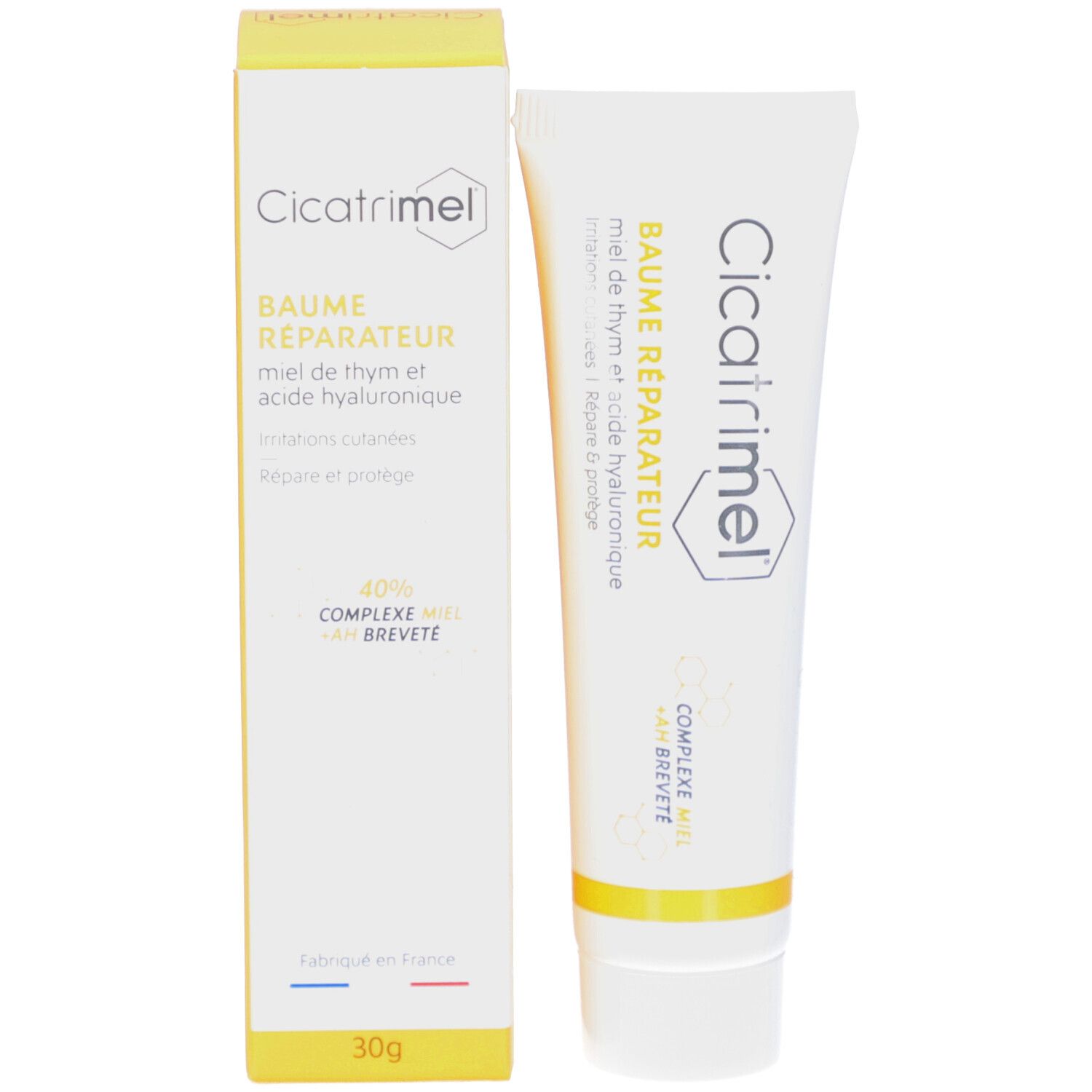 Emballage du produit avec tube et boîte. Les deux avec nom et logo. Texte français.