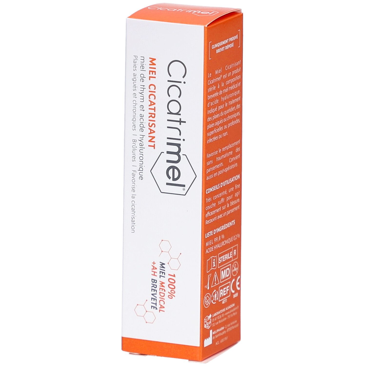 Emballage produit. Boîte blanche avec couvercle orange. Texte: Miel Cicatrisant, 30g. Logo et informations.