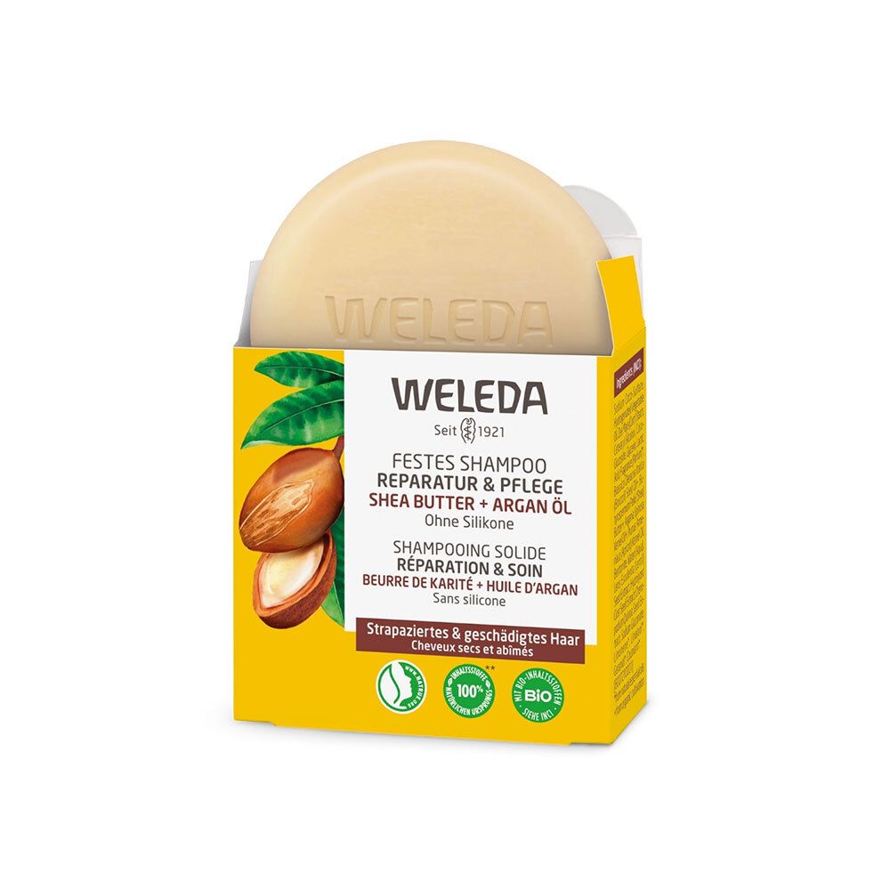WELEDA shampooing solide dans un emballage jaune. Savon rond, logo et texte. Beurre de karité et huile d'argan.