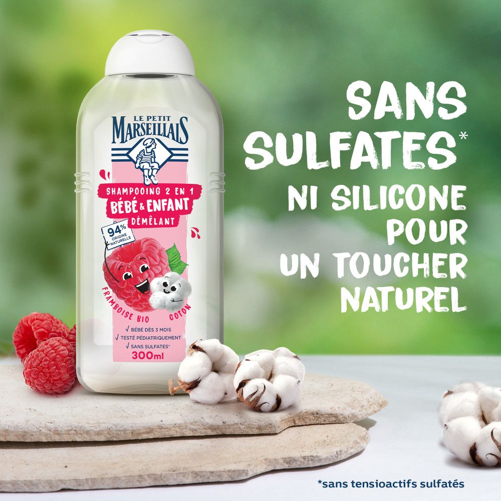 Flacon avec framboises et coton. Texte: Sans Sulfates, Ni Silicone Pour Un Toucher Naturel.