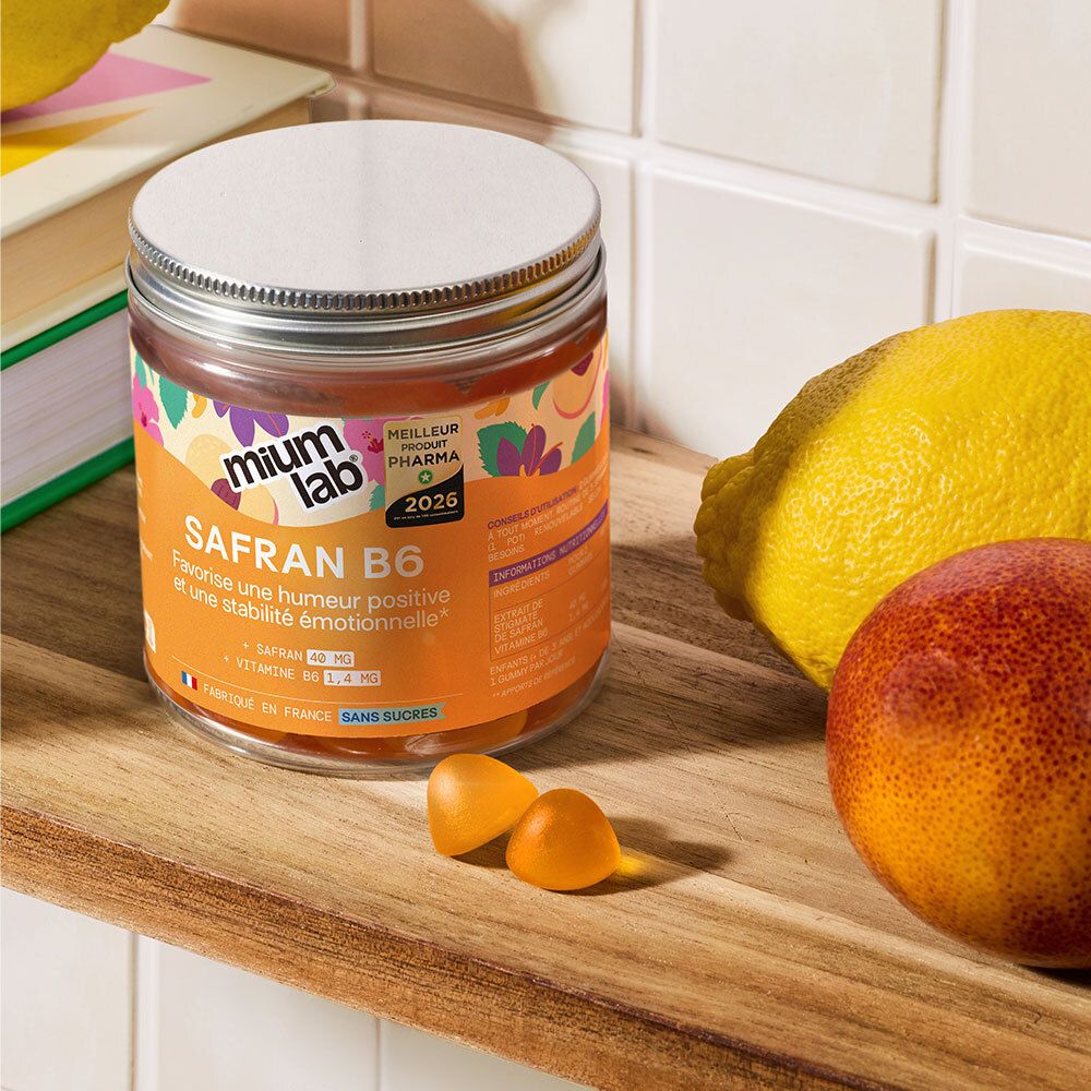 Pot de Safran B6 avec gummies, citron et orange. Inscription: Safran B6, Favorise une humeur positive.