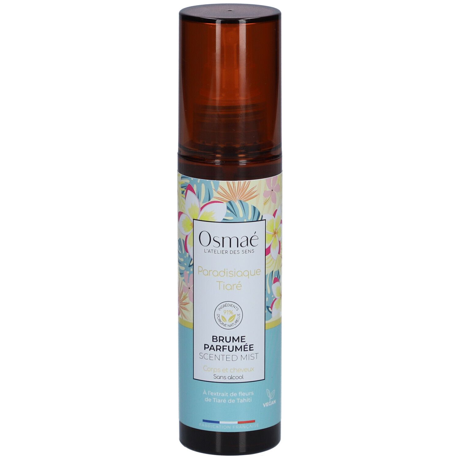 Flacon spray marron avec étiquette florale. Texte: OSMAE, Paradisiaque Tiaré, Brume Parfumée, Scented Mist. Label Vegan.
