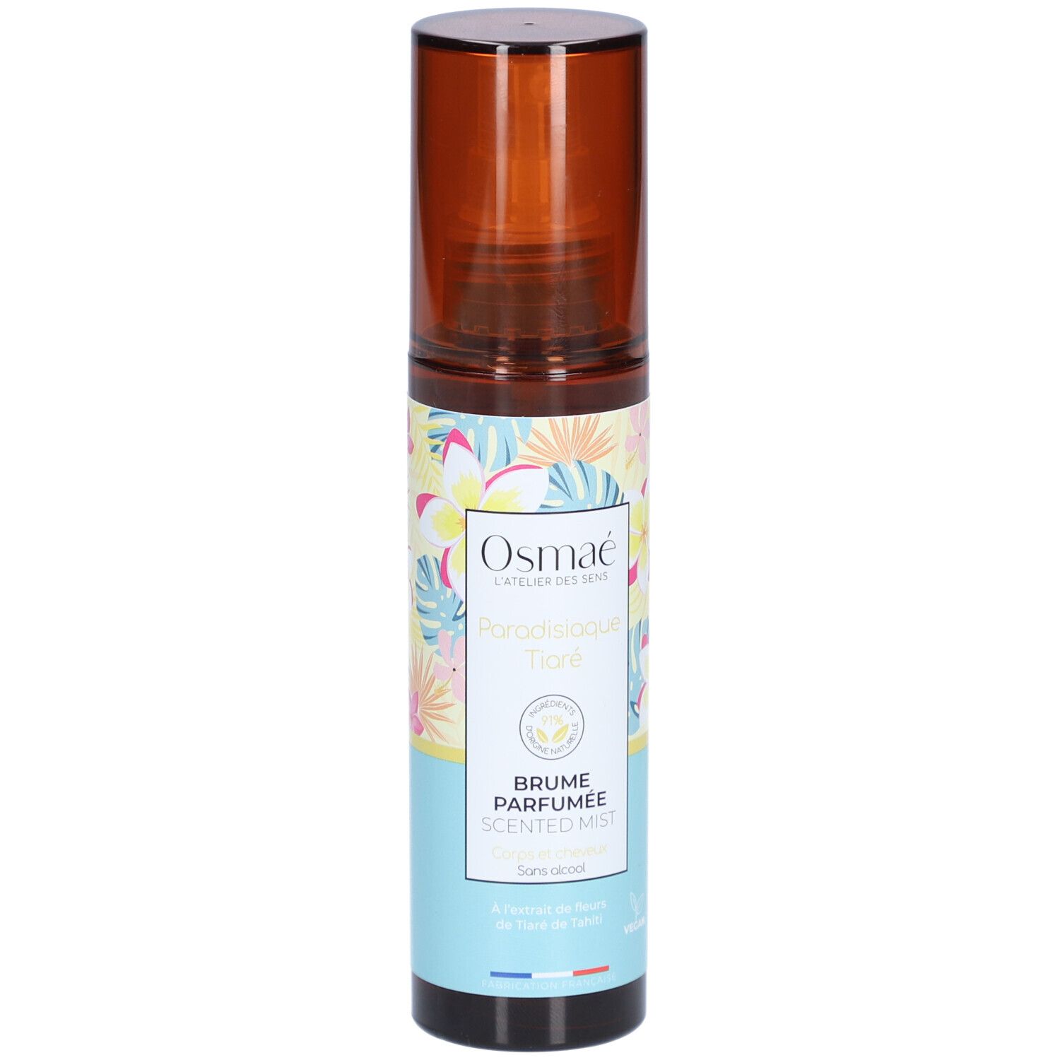 Flacon spray marron avec étiquette florale. Texte: OSMAE, Paradisiaque Tiaré, Brume Parfumée, Scented Mist. Label Vegan.