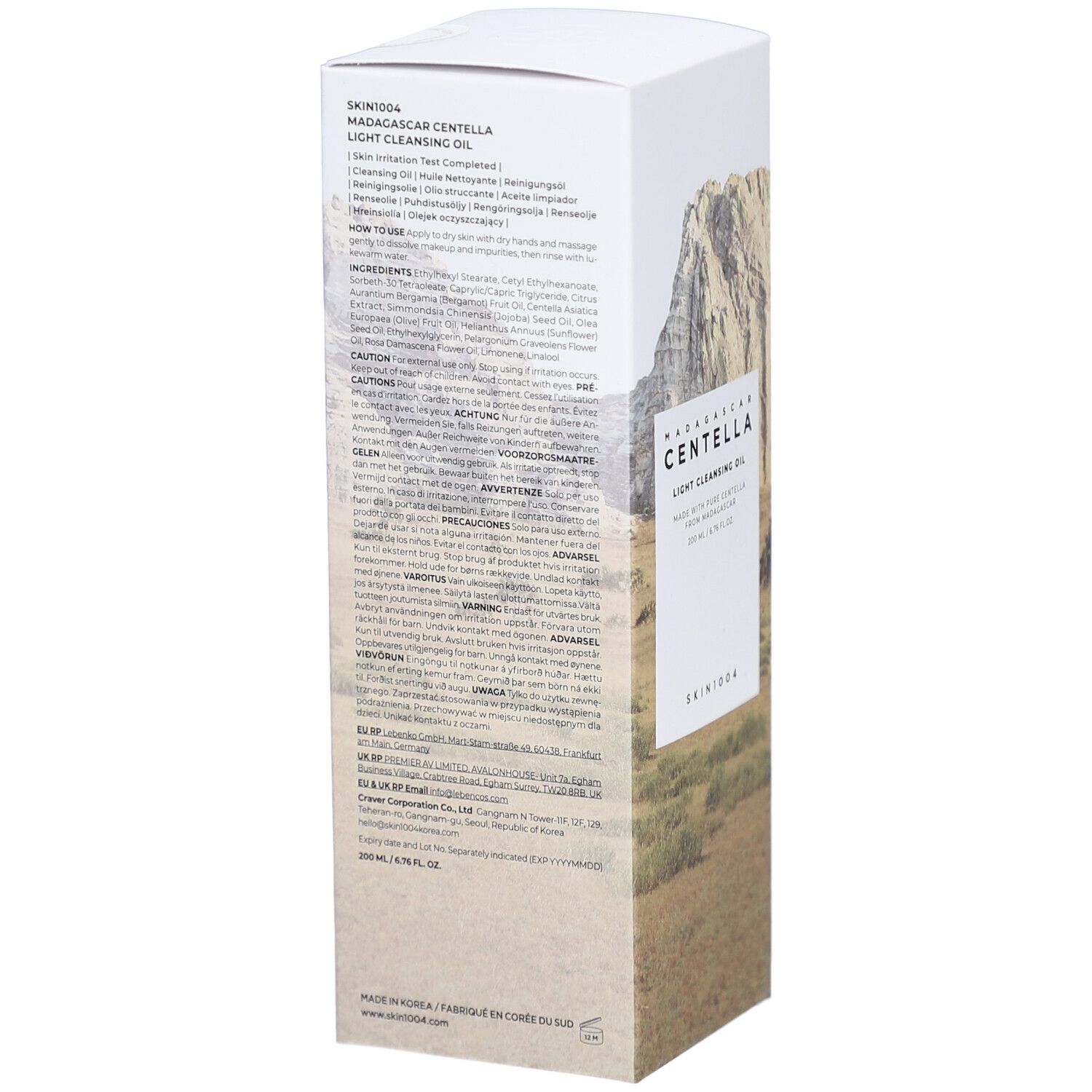 Emballage blanc avec texte. Contient des informations sur les ingrédients et l'utilisation. Marque : SKIN1004.