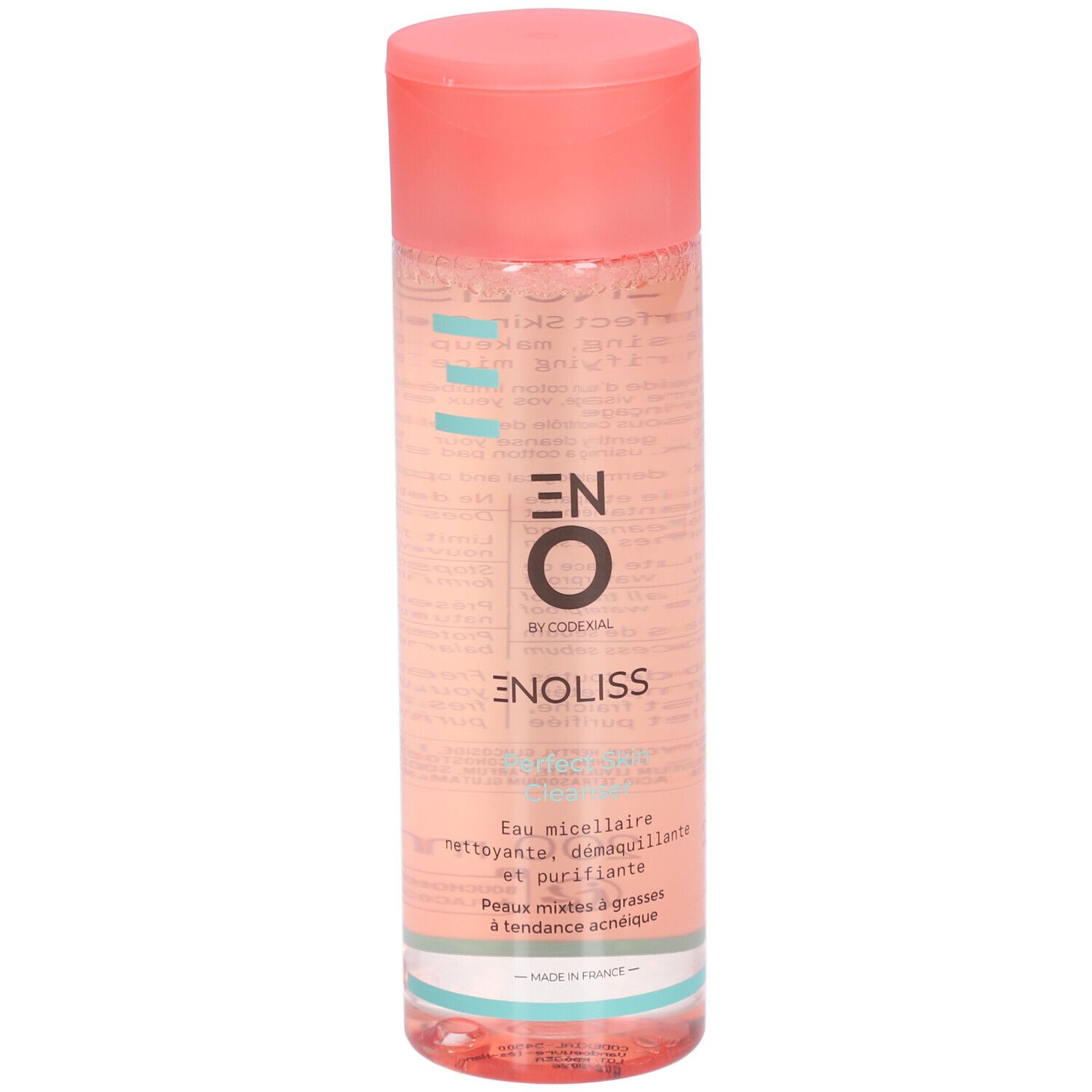 Flacon cylindrique rose. Inscription: ENOLISS, Perfect Skin Cleanser. Étiquette du produit visible.