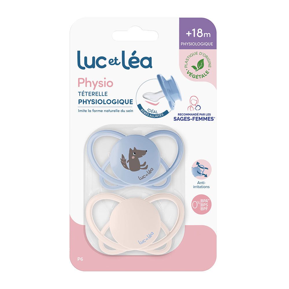 Deux sucettes Luc et Léa dans un emballage. Une bleue avec un loup, une beige. Recommandé pour les +18 mois. Forme physiologique.