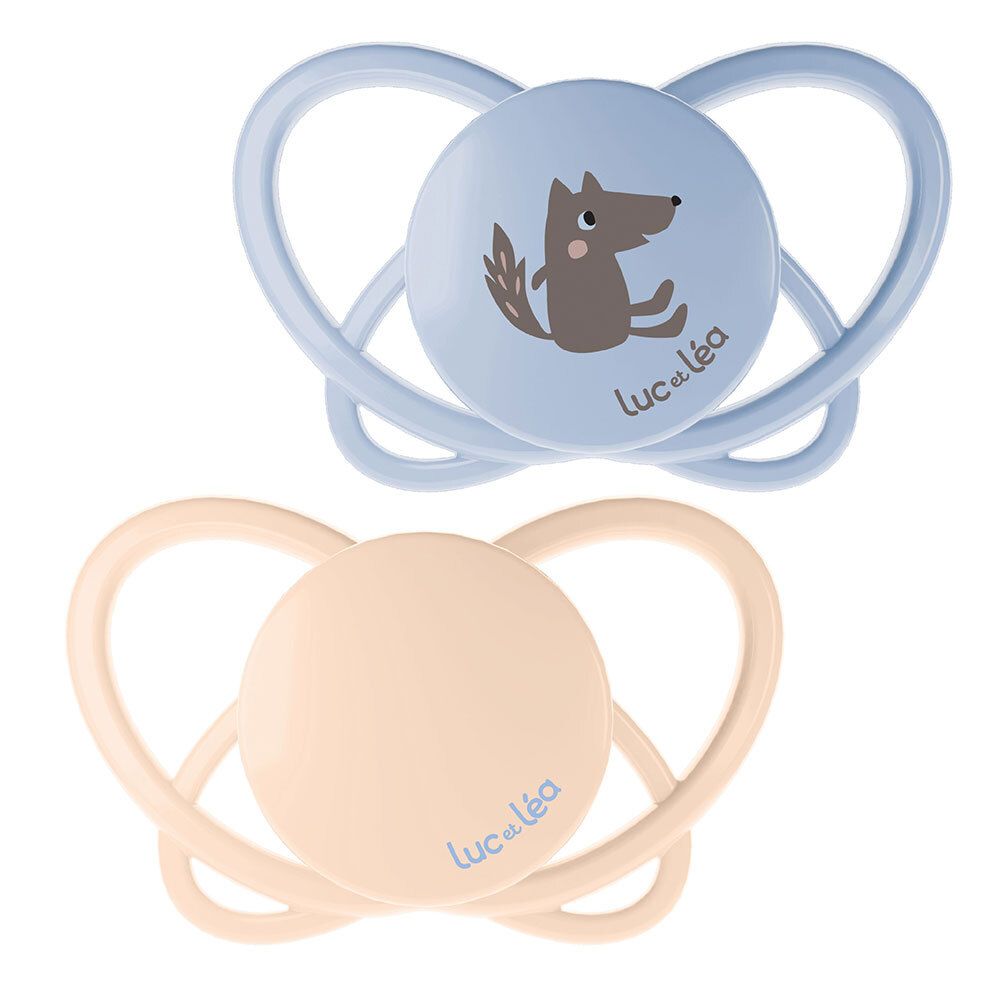 Deux sucettes. Une bleue avec un loup, une beige. Marque : Luc et Léa. Forme physiologique.