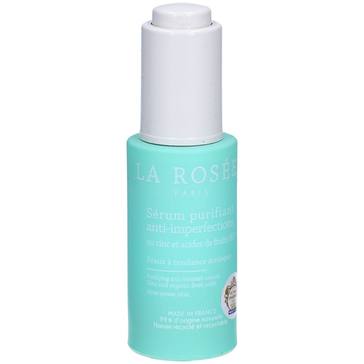 Flacon turquoise avec bouchon blanc. Inscription: La Rosée Paris, Sérum purifiant anti-imperfections. Logo de certification visible.