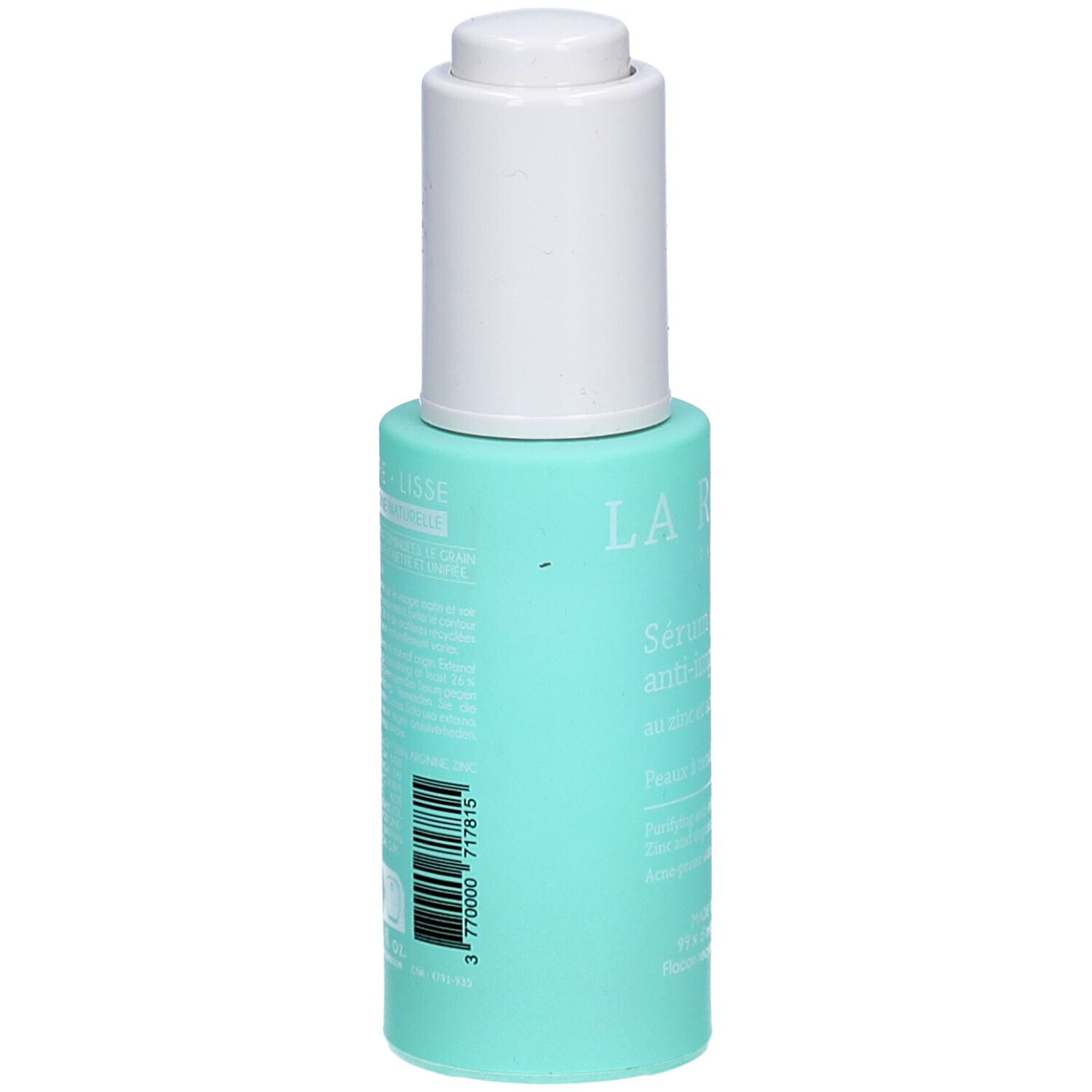 Flacon turquoise avec bouchon blanc. Verso avec texte et code-barres. Nom du produit non visible.