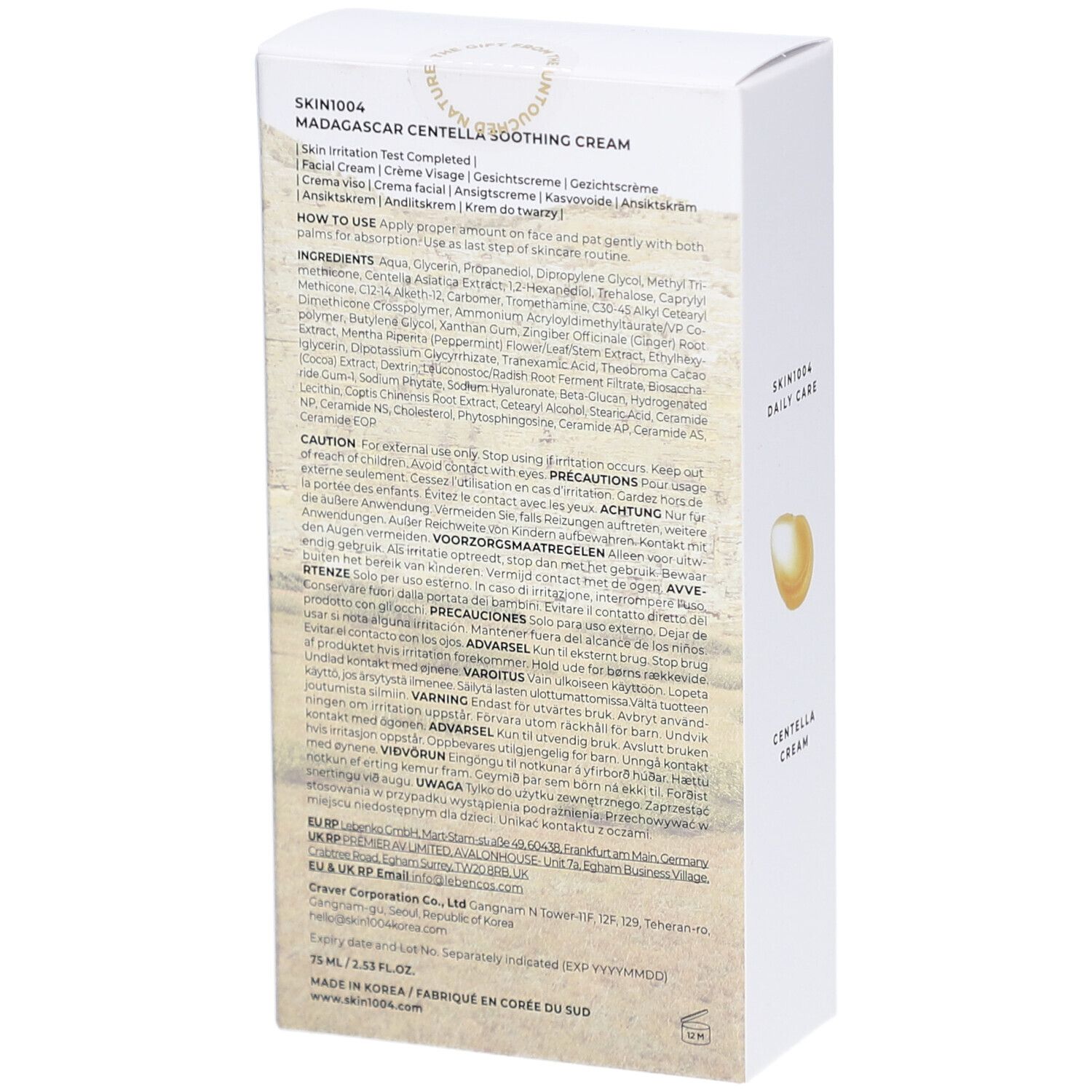 Dos de la boîte blanche avec informations et ingrédients. Texte: SKIN1004.