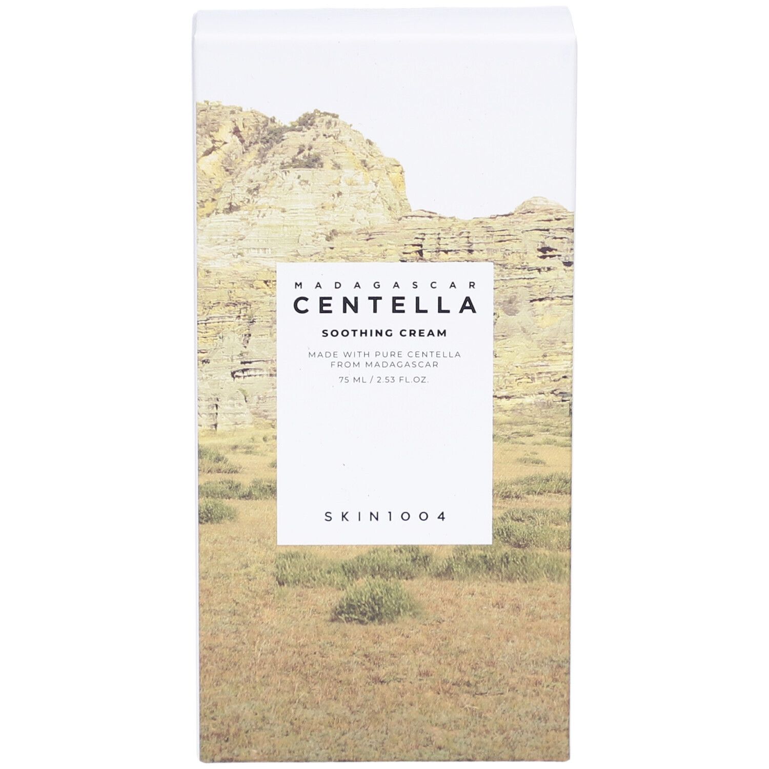 Boîte blanche avec nom du produit et paysage. Texte: Madagascar Centella Soothing Cream, SKIN1004.