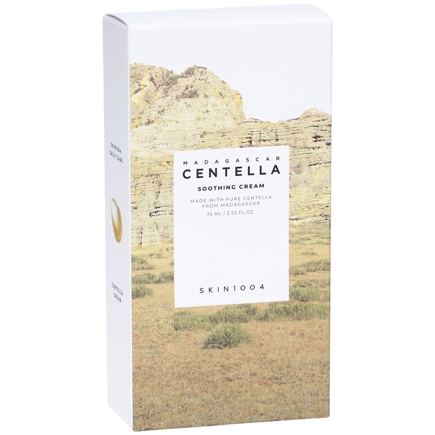 Boîte blanche avec nom du produit et paysage. Texte: Madagascar Centella Soothing Cream, SKIN1004.