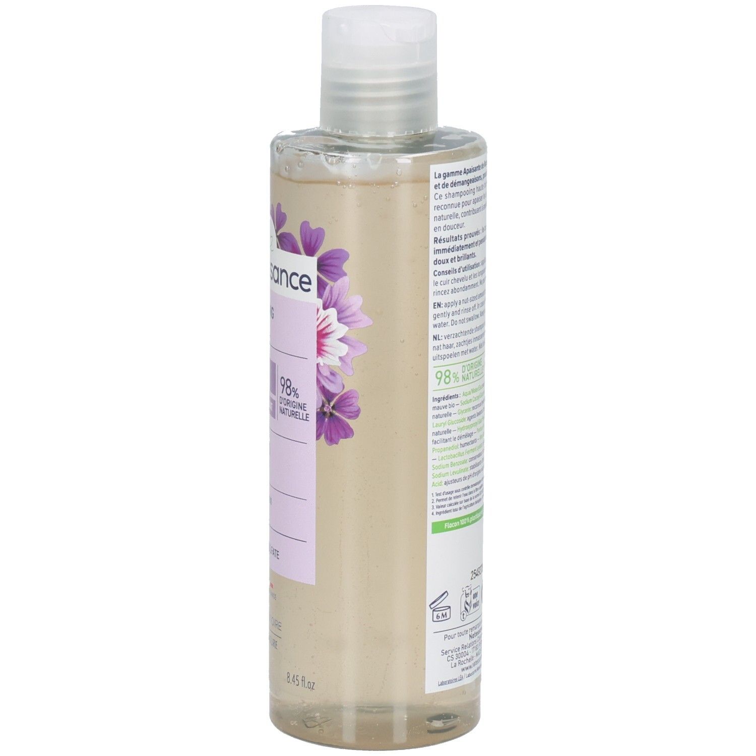 Côté du flacon de shampooing. Étiquette lilas avec fleurs. Texte en français. Informations sur le produit.