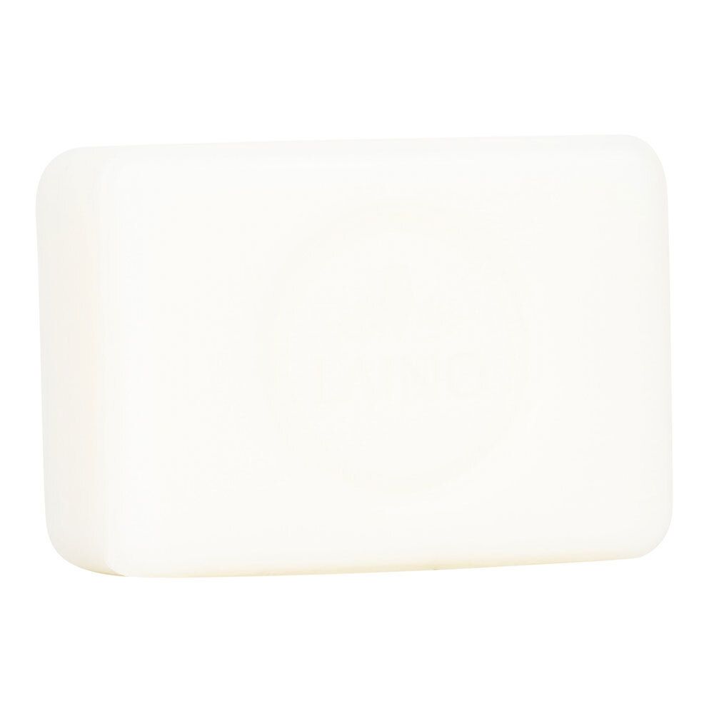 Bloc de savon de Marseille rectangulaire blanc avec un léger motif en relief sur la surface.