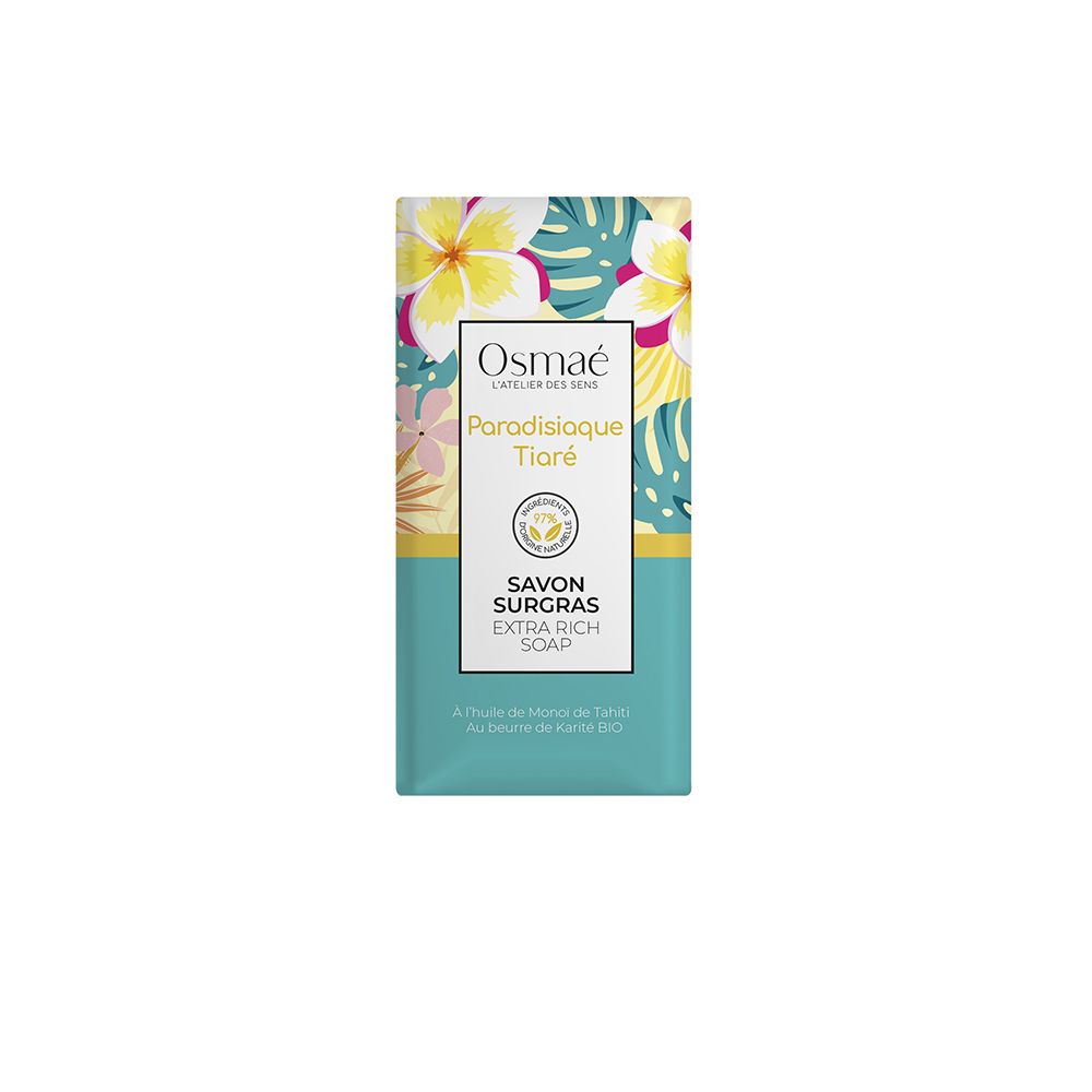 Savon rectangulaire emballé. Marque OSMAE, nom Paradisiaque Tiaré. Inscription Savon Surgras Extra Rich Soap. Motif floral.