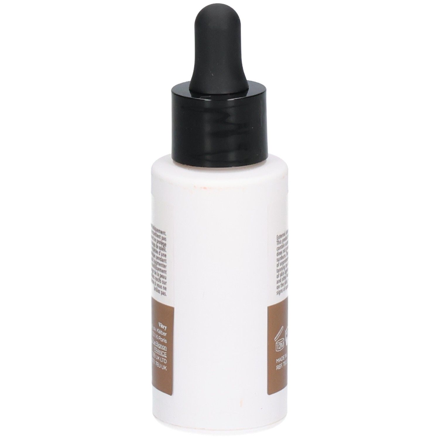 Dos du flacon blanc avec bouchon noir et pipette. Texte et symboles sur fond marron.