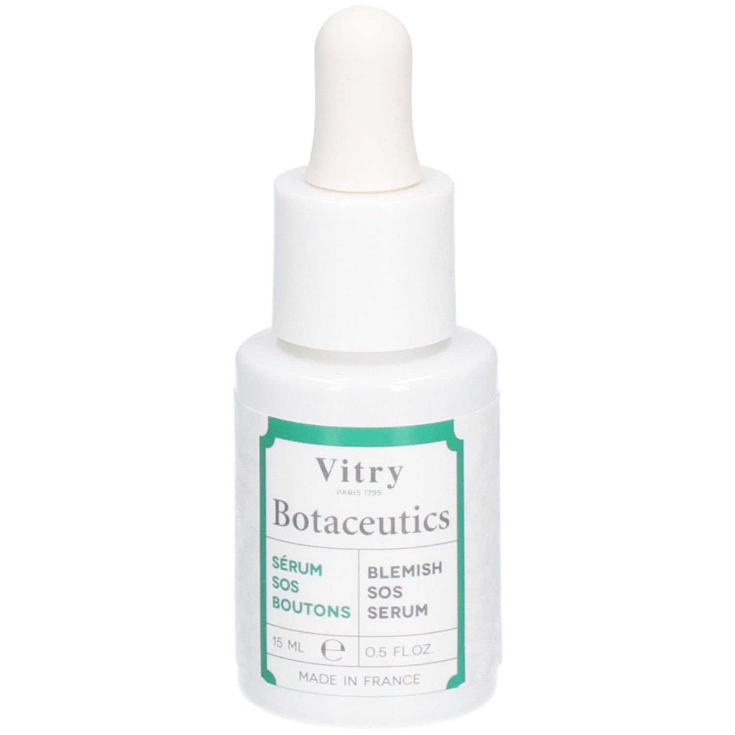 Flacon blanc avec compte-gouttes. Inscriptions : Vitry Botaceutics, Sérum SOS Boutons, Blemish SOS Serum. Étiquettes vertes. 15 ml.