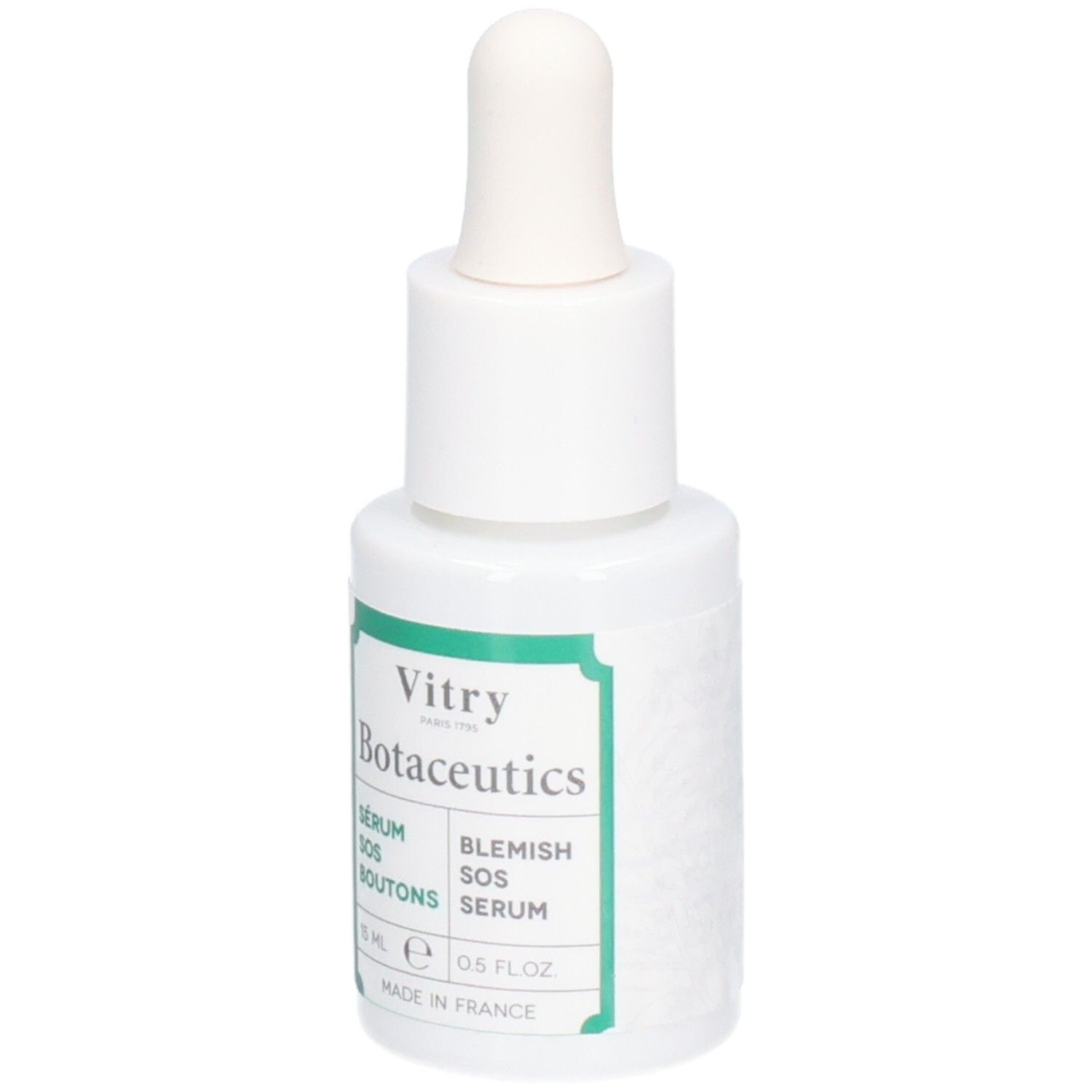 Flacon blanc avec compte-gouttes. Inscriptions : Vitry Botaceutics, Sérum SOS Boutons, Blemish SOS Serum. Étiquettes vertes. 15 ml.