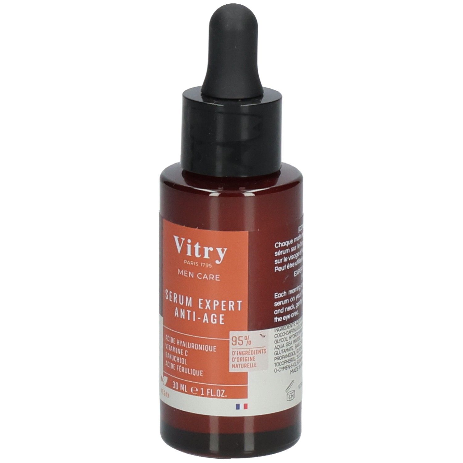 Flacon brun avec bouchon noir et pipette. Étiquette avec nom du produit et ingrédients. Logo végan.