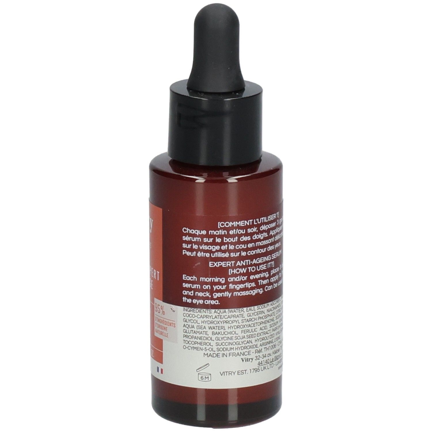 Flacon brun avec bouchon noir et pipette. Texte avec instructions d'utilisation et ingrédients.