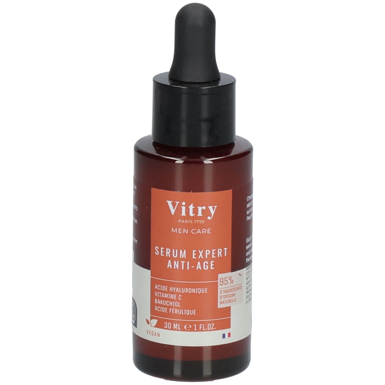 Flacon brun avec bouchon noir et pipette. Étiquette avec nom du produit et ingrédients. Logo végan.