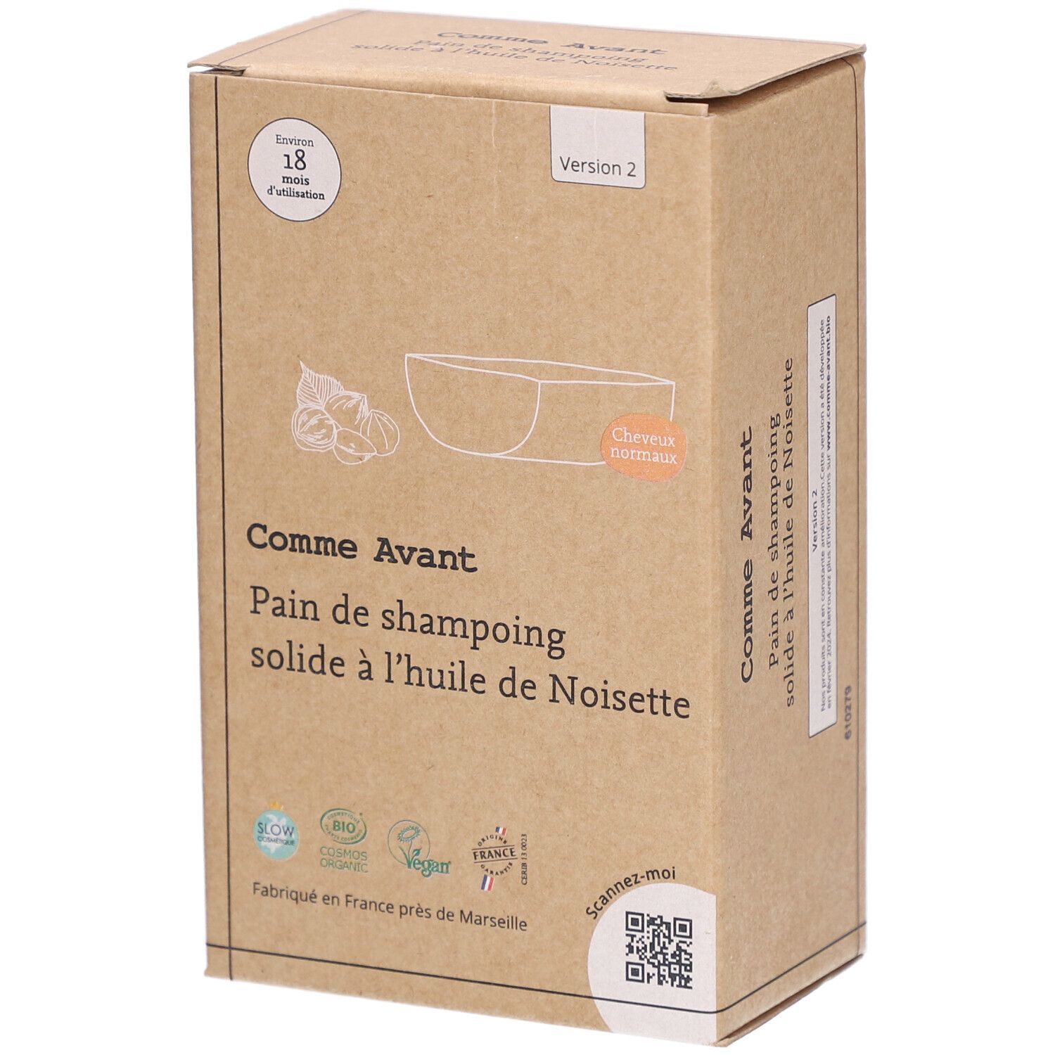 Boîte en carton avec informations produit. Inscription: Comme Avant, Pain de shampoing solide à l'huile de Noisette. Illustration de noisettes.