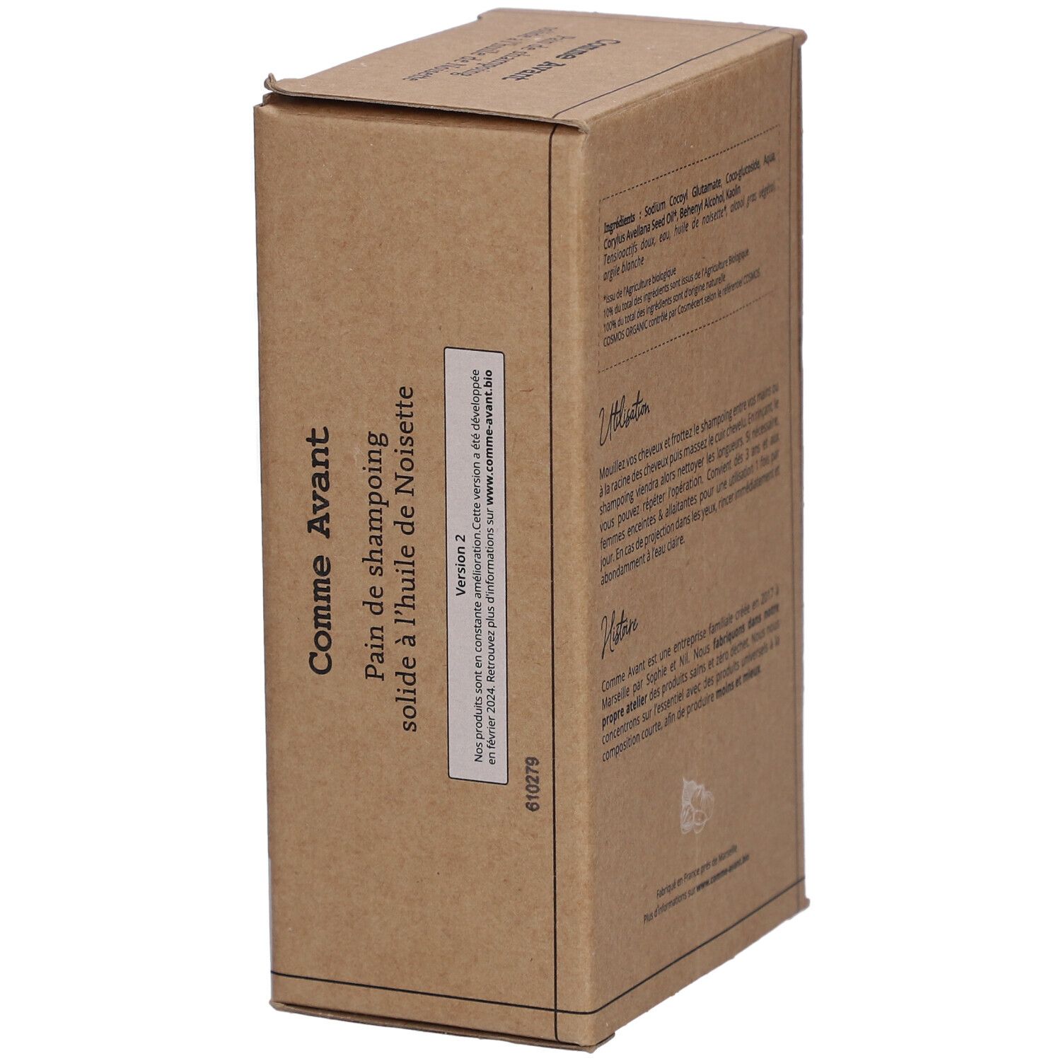 Boîte en carton avec informations produit. Inscription: Comme Avant, Pain de shampoing solide à l'huile de Noisette. Texte et logo.