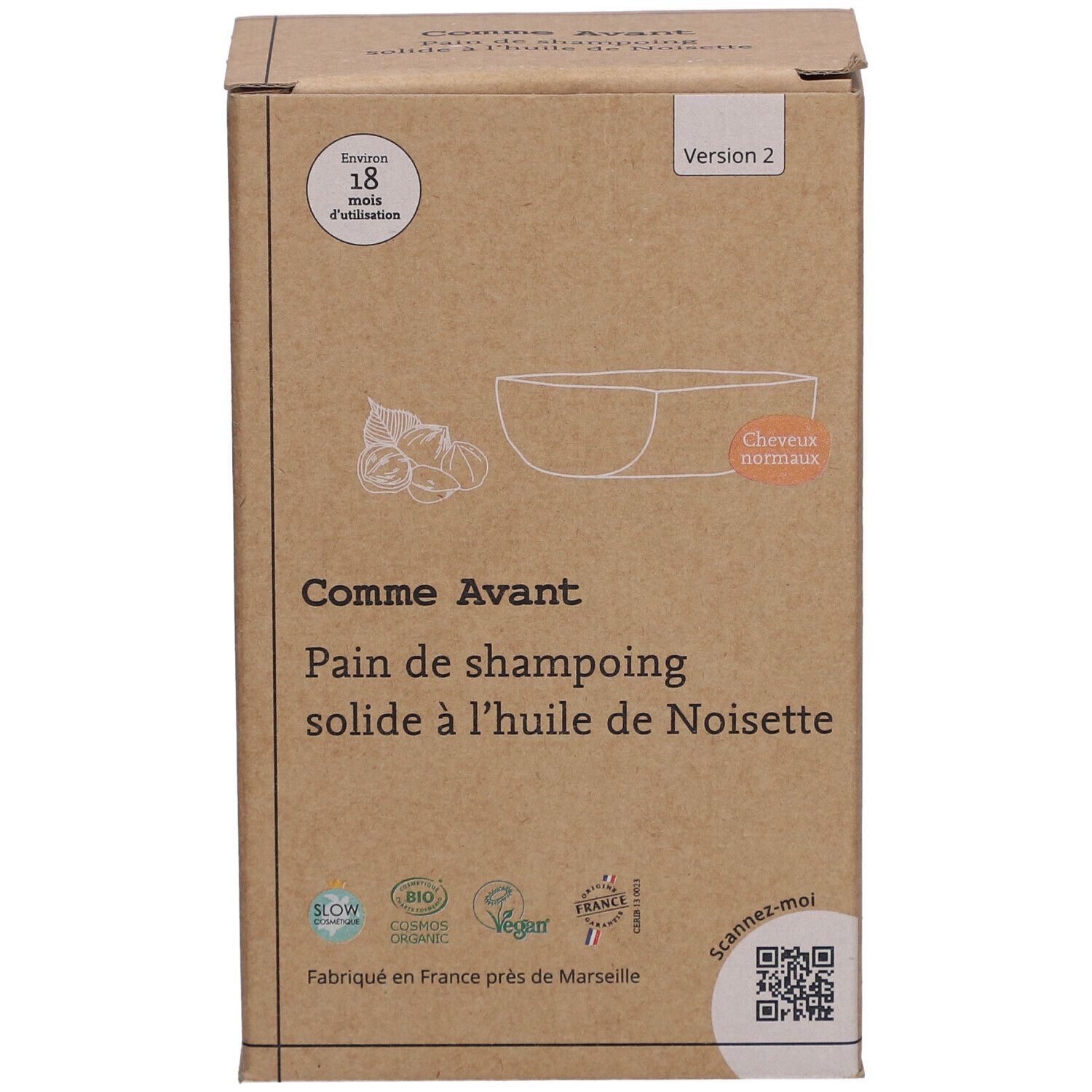 Boîte en carton avec informations produit. Inscription: Comme Avant, Pain de shampoing solide à l'huile de Noisette. Avec illustration.