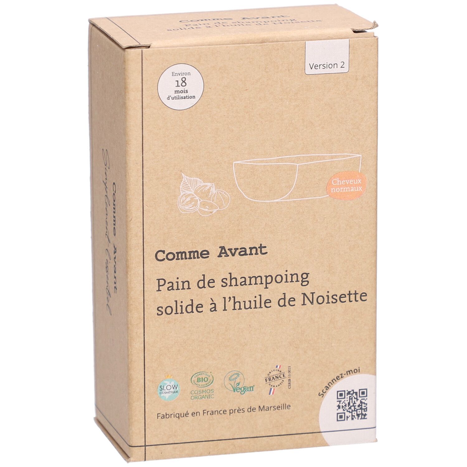 Boîte en carton avec informations produit. Inscription: Comme Avant, Pain de shampoing solide à l'huile de Noisette. Avec illustration.