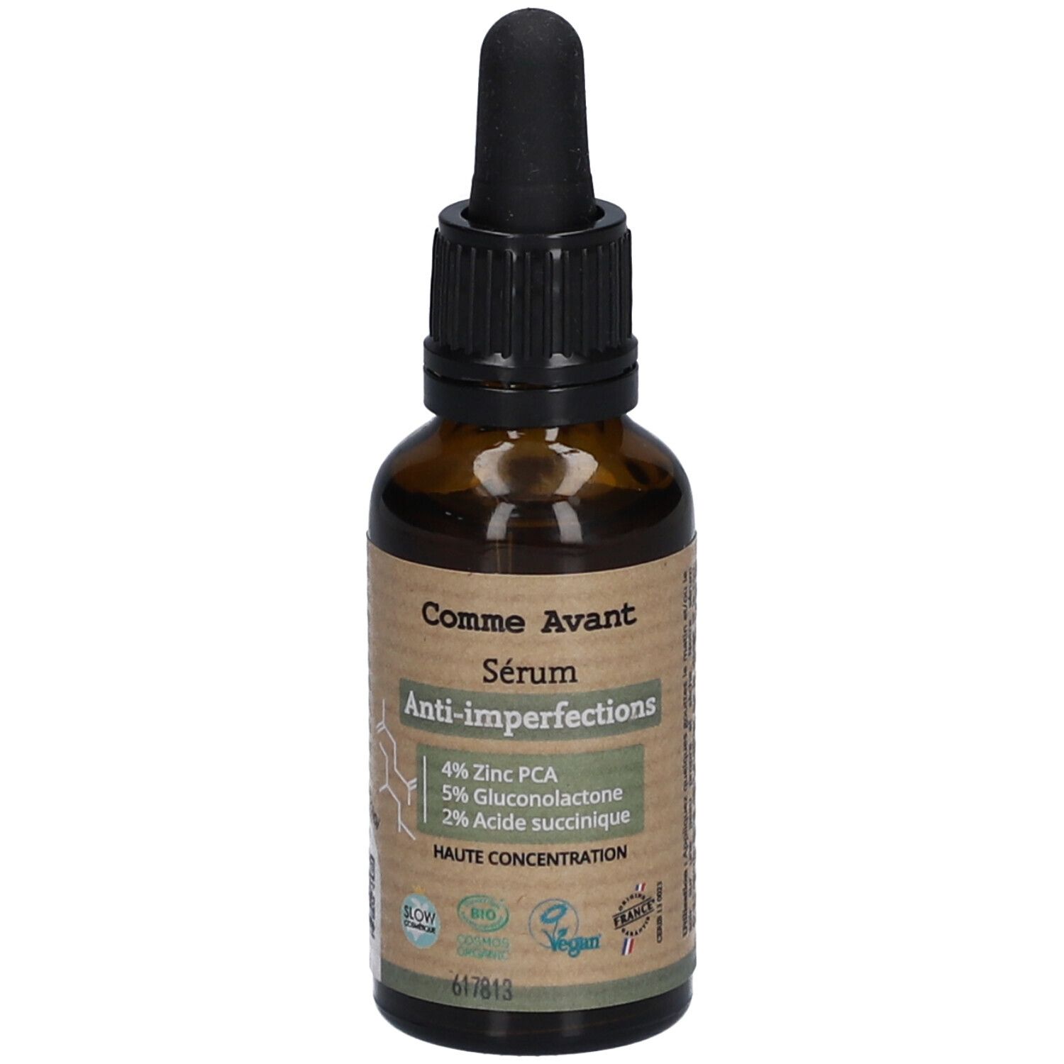 Flacon en verre brun avec compte-gouttes noir. Étiquette avec nom du produit et ingrédients: 4% Zinc PCA, 5% Gluconolactone, 2% Acide succinique.