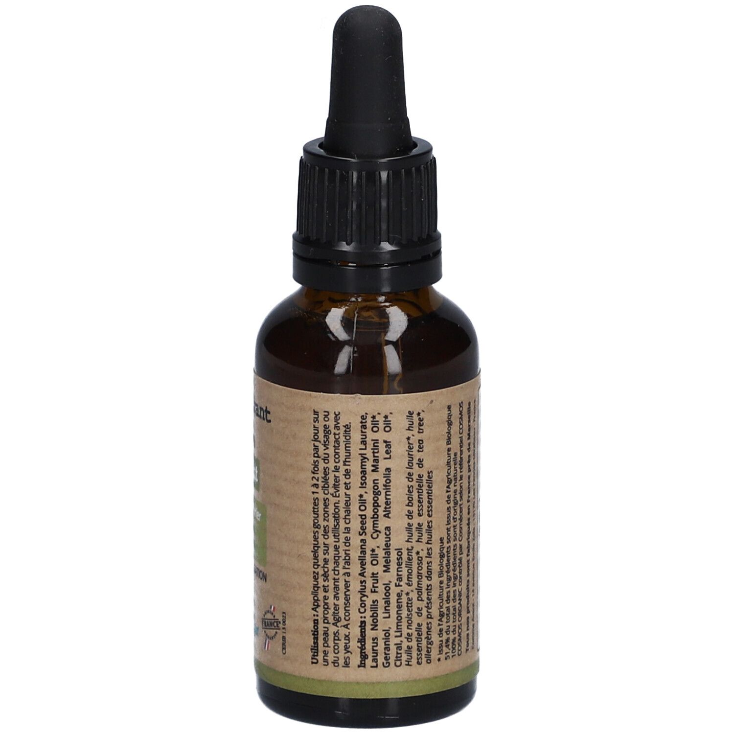 Flacon en verre brun avec bouchon noir et pipette. Étiquette avec ingrédients et instructions d'utilisation. Label vegan.