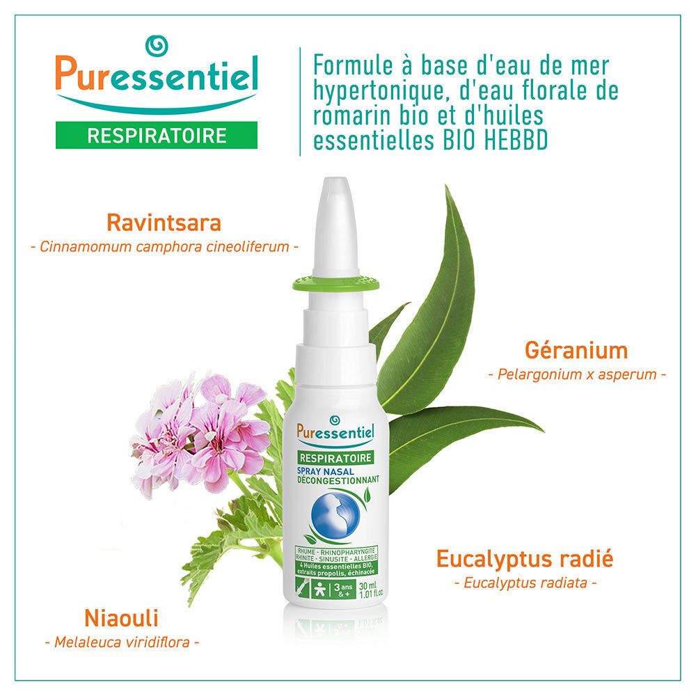 Flacon spray nasal Puressentiel avec embout, entouré de plantes et fleurs.
