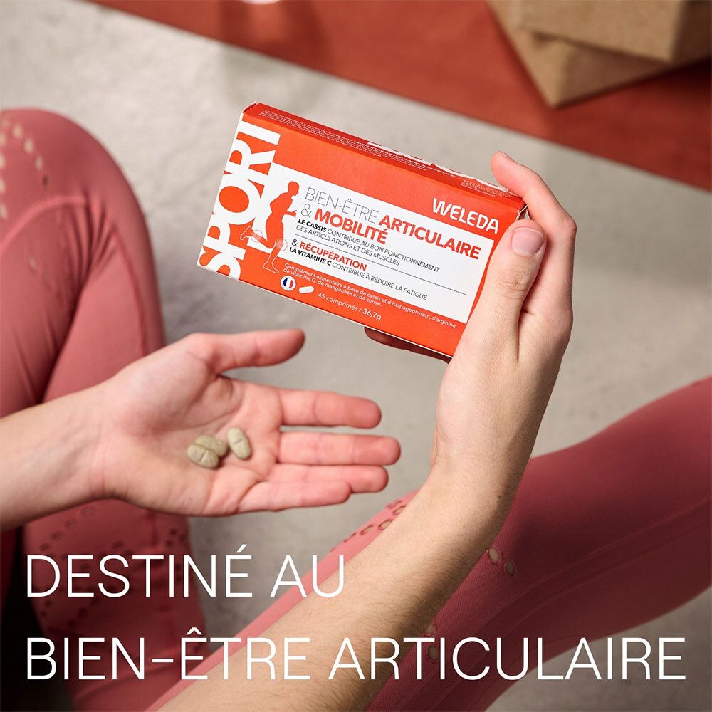 Mains tenant des comprimés. Inscription: Destiné au bien-être articulaire.