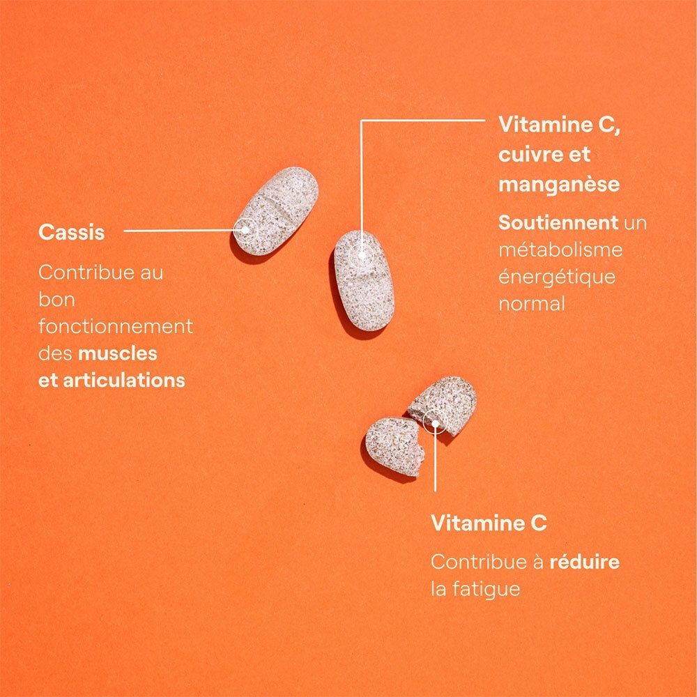 Trois comprimés sur fond orange. Inscription: Vitamine C, cuivre et manganèse.