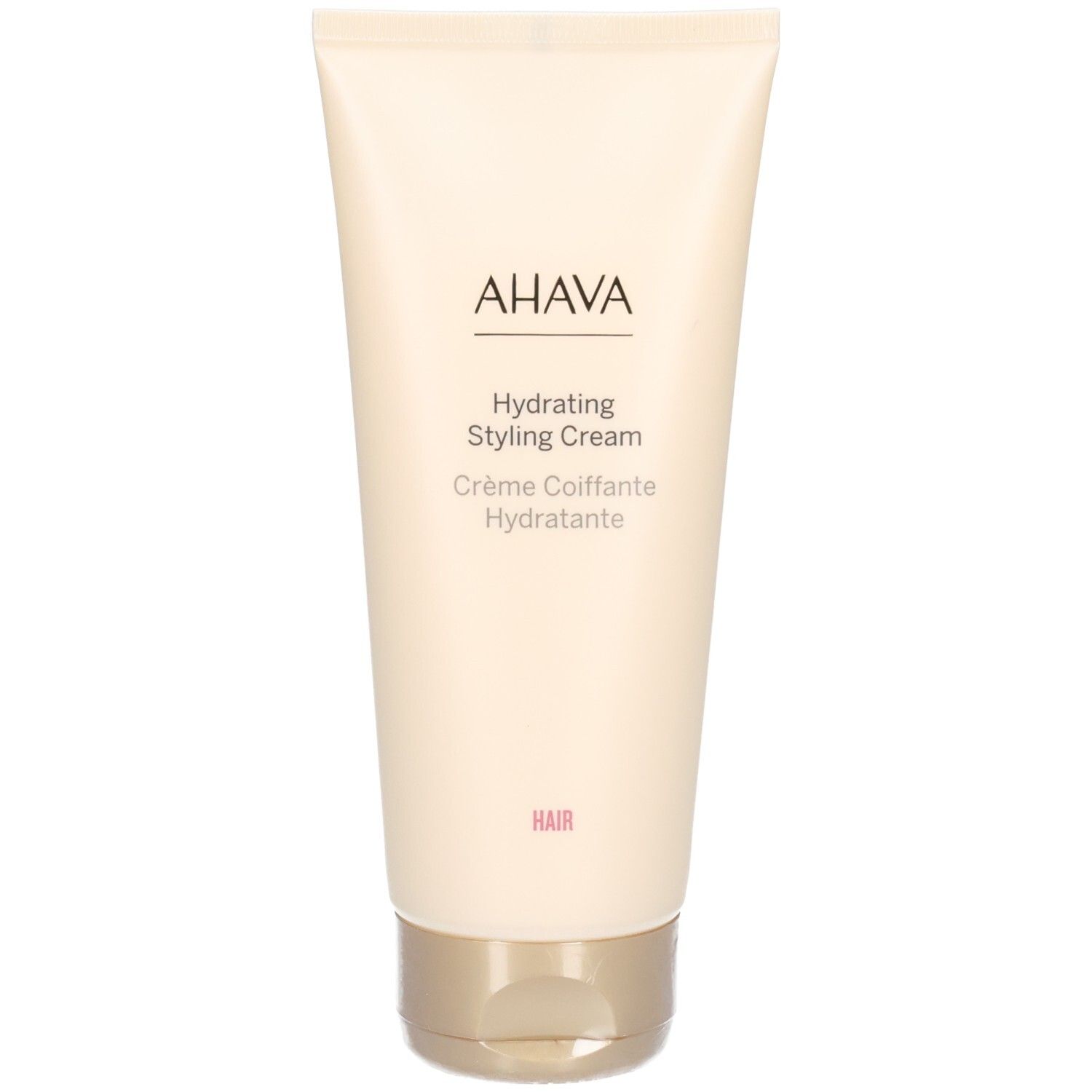 Tube beige avec bouchon doré. Inscription : AHAVA, Hydrating Styling Cream, Crème Coiffante Hydratante. Mot : HAIR.