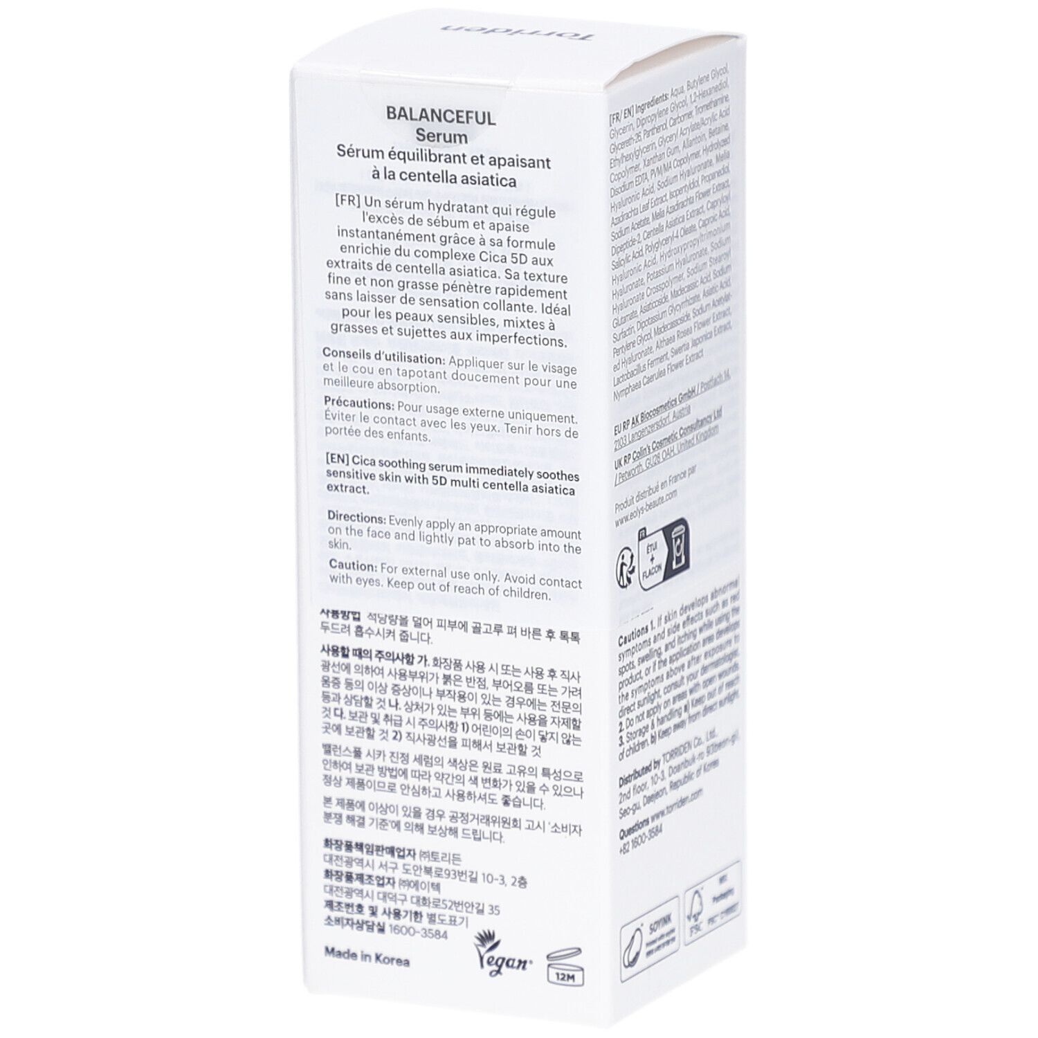 Boîte blanche avec texte. Description du produit en français. Logos végan et durabilité.