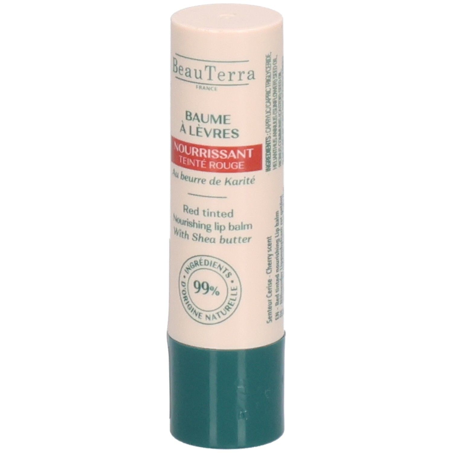 Bâton de baume à lèvres. Étui beige et vert. Inscription: Baume à Lèvres, Nourrissant Teinte Rouge, Au beurre de Karité. Ingrédients 99% naturels.