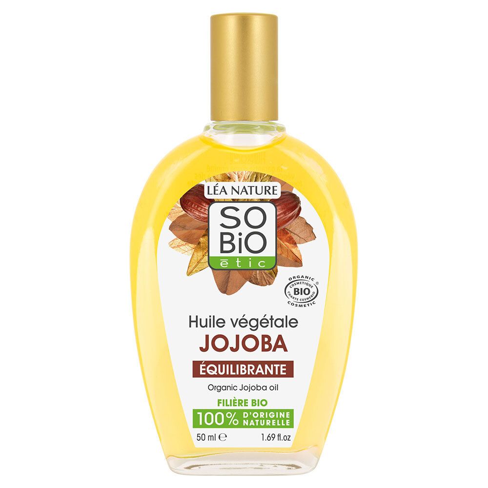 Flacon d'huile de Jojoba SO BIO ETIC. Liquide jaune dans flacon transparent, bouchon doré. Étiquette avec informations produit.